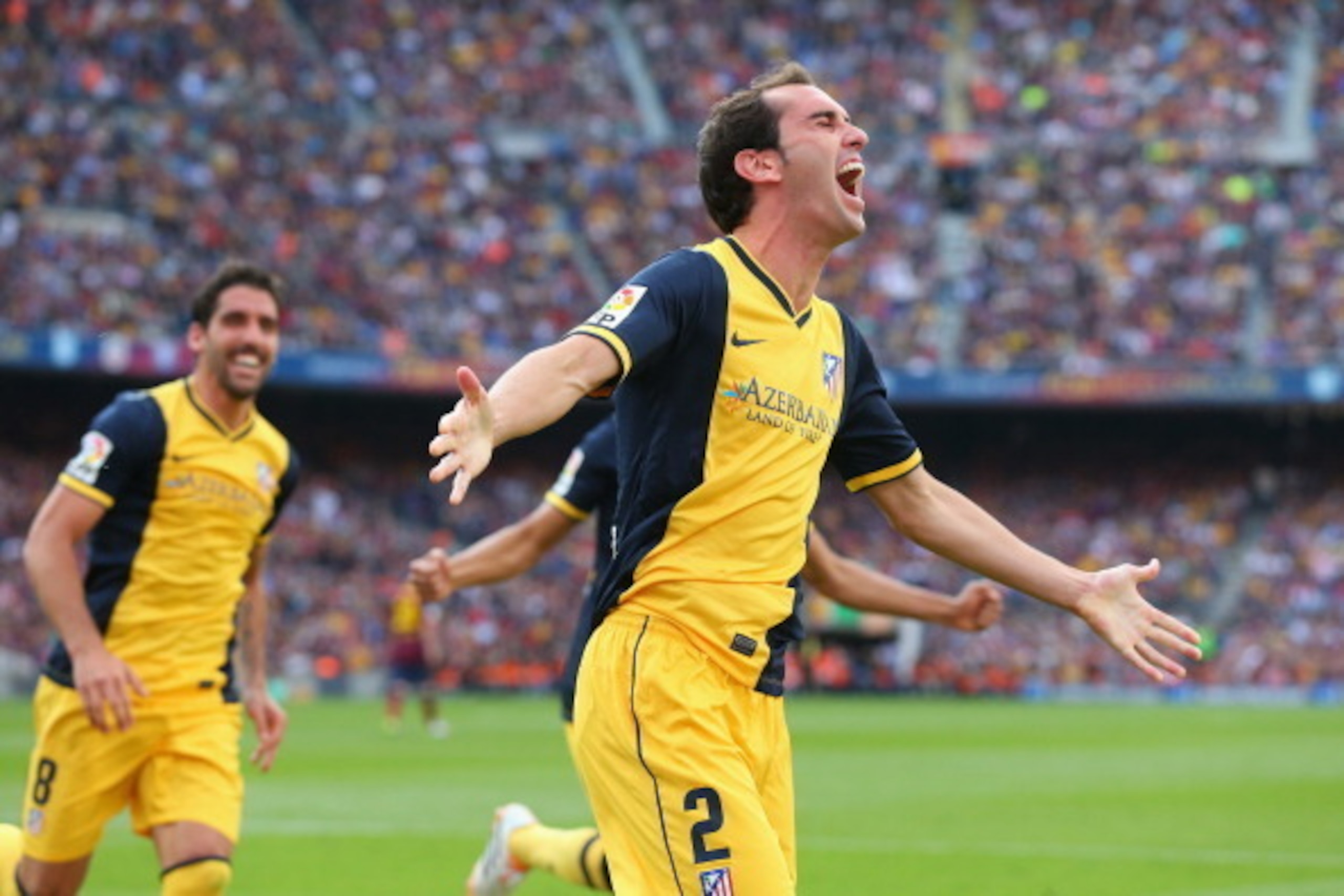 BARCELONA, SPAIN - MAY 17:  Diego Godin of Club Atletico de Madrid celebrates after scoring his goal during the La Liga match between FC Barcelona and Club Atletico de Madrid at Camp Nou on May 17, 2014 in Barcelona, Spain.  (Photo by Alex Livesey/Getty I