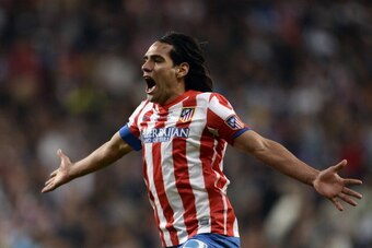 Atletico Madrid's Colombian forward Radamel Falcao celebrates after winning the Spanish King's Cup (Copa del Rey) final football match Real Madrid vs Atletico de Madrid at Santiago Bernabeu stadium in Madrid on May 18, 2013. Atletico Madrid won the match 