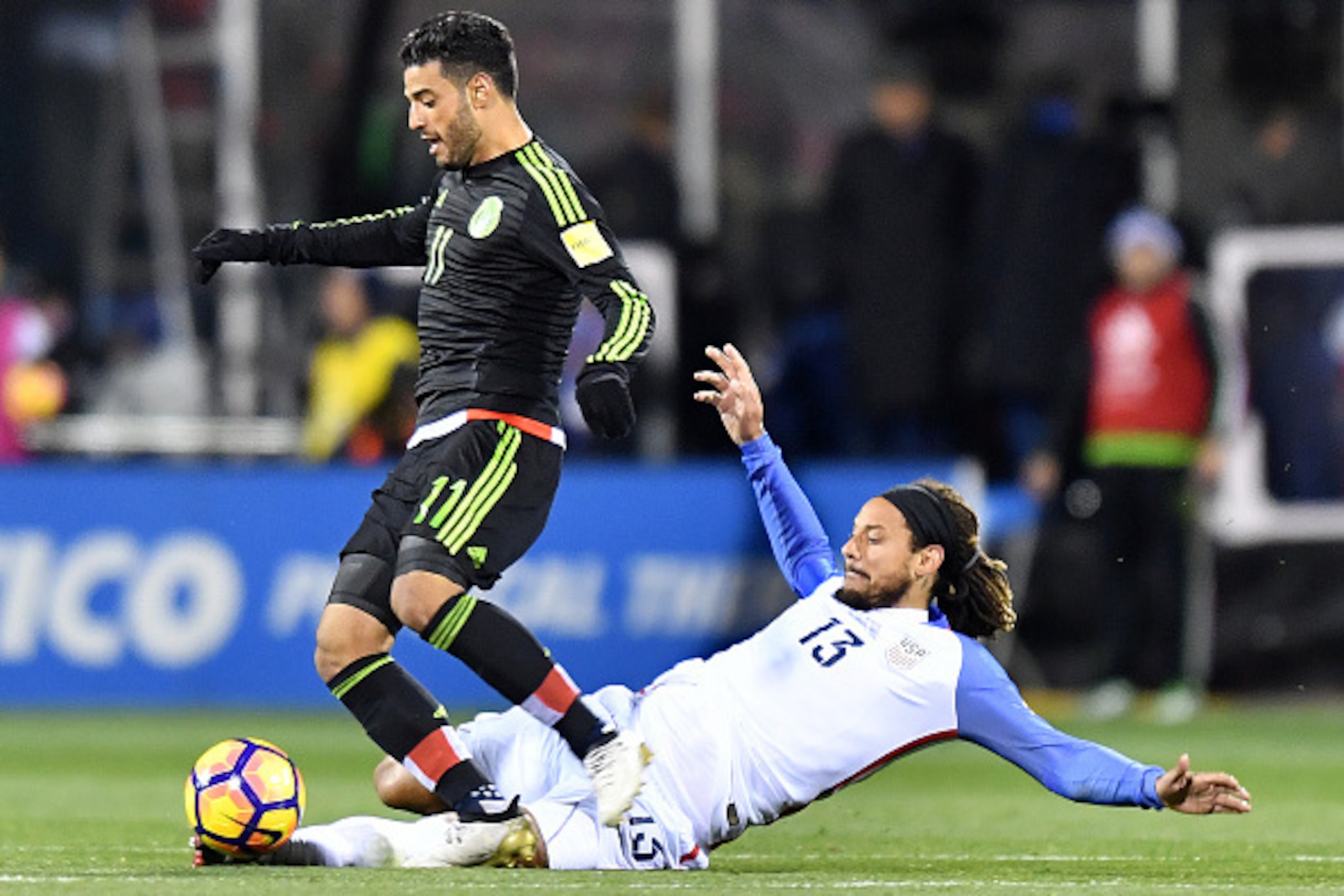 COLUMBUS, OH - NOVEMBER 11: Carlos Vela #11 of Mexico is tackled by Jermaine Jones #13 of the United States in the first half during the FIFA 2018 World Cup Qualifier at MAPFRE Stadium on November 11, 2016 in Columbus, Ohio. (Photo by Jamie Sabau/Getty Im