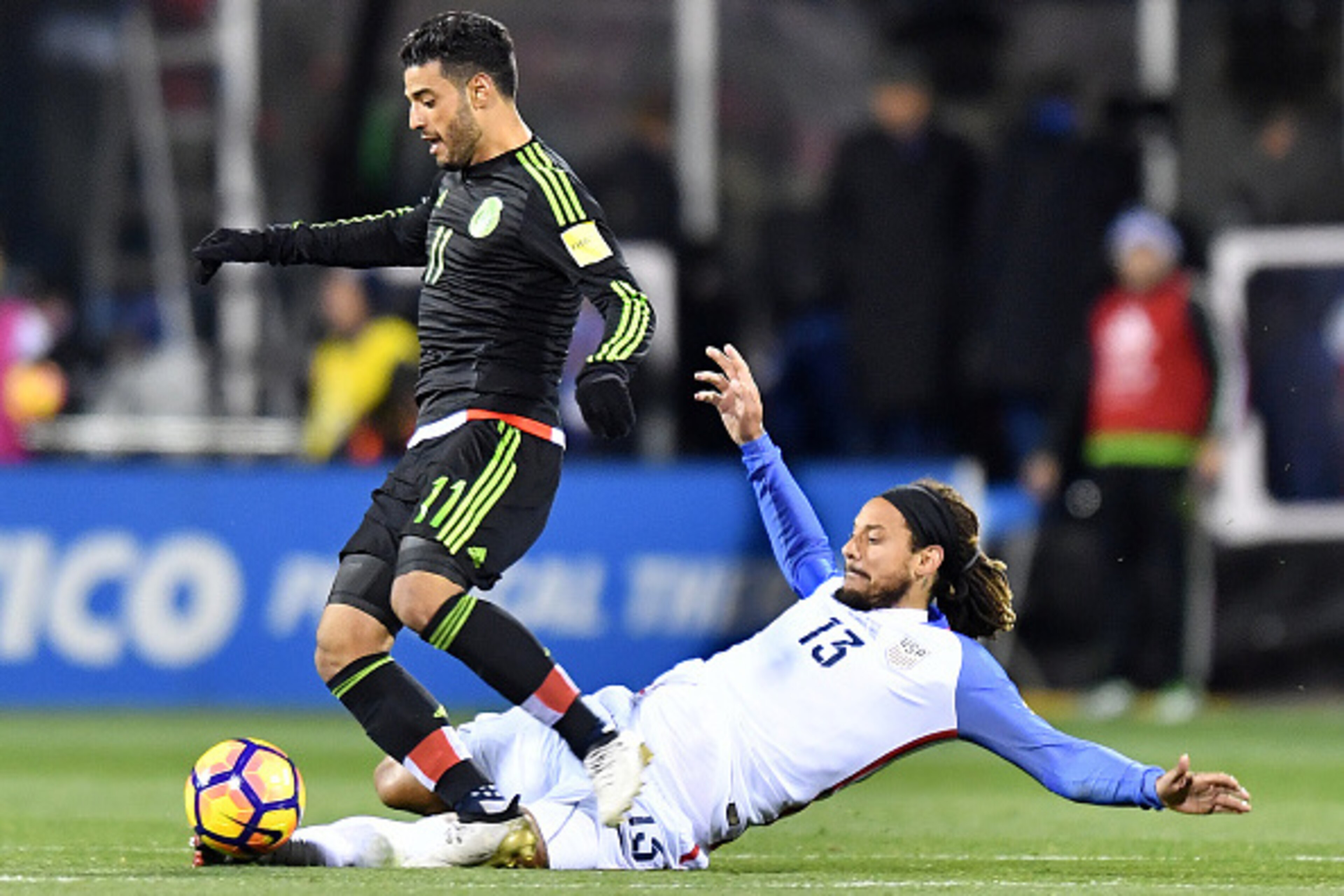 COLUMBUS, OH - NOVEMBER 11: Carlos Vela #11 of Mexico is tackled by Jermaine Jones #13 of the United States in the first half during the FIFA 2018 World Cup Qualifier at MAPFRE Stadium on November 11, 2016 in Columbus, Ohio. (Photo by Jamie Sabau/Getty Im