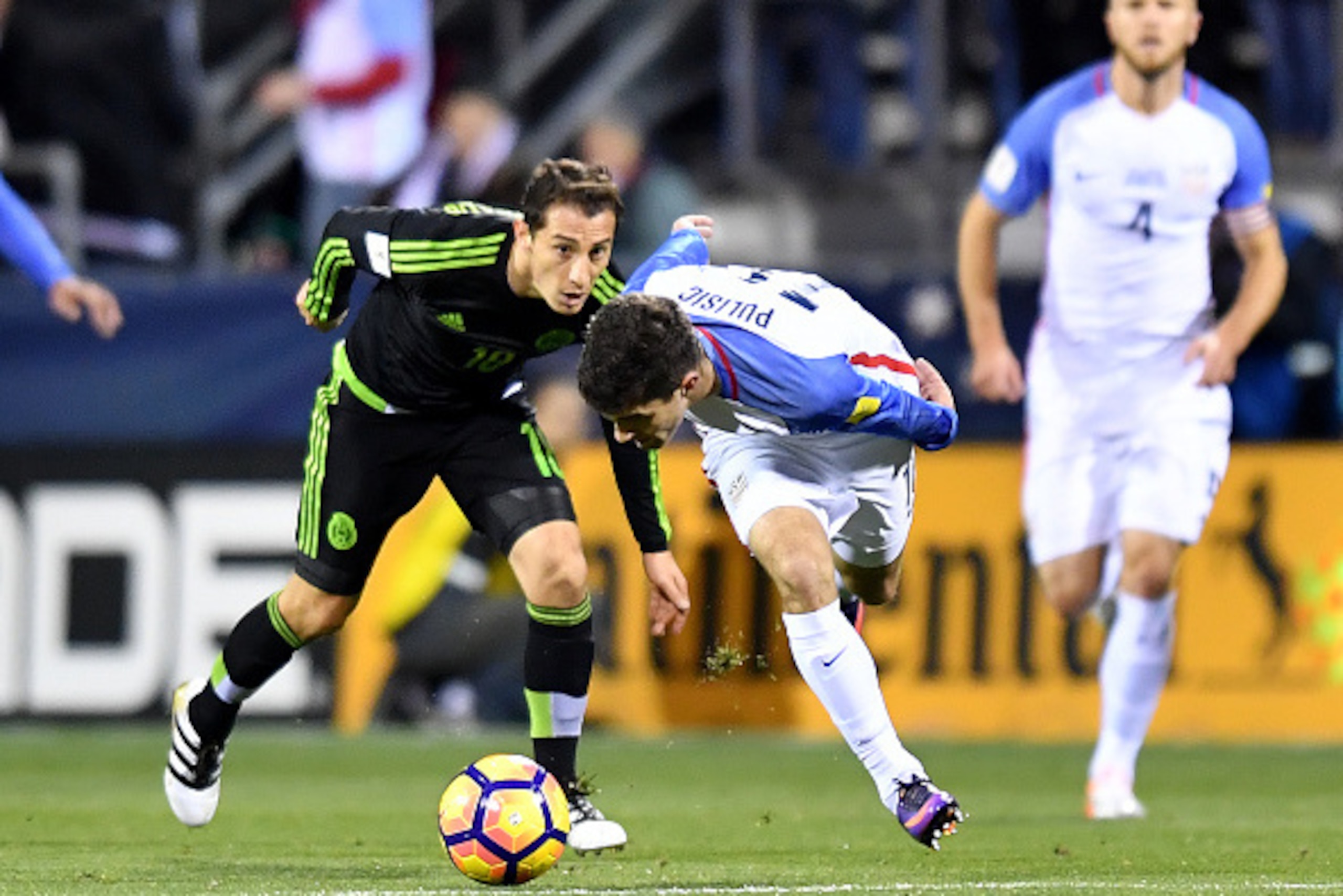 COLUMBUS, OH - NOVEMBER 11: Christian Pulisic #10 of the United States battles for the ball with Andres Guardado #18 of Mexico in the first half during the FIFA 2018 World Cup Qualifier at MAPFRE Stadium on November 11, 2016 in Columbus, Ohio. (Photo by J