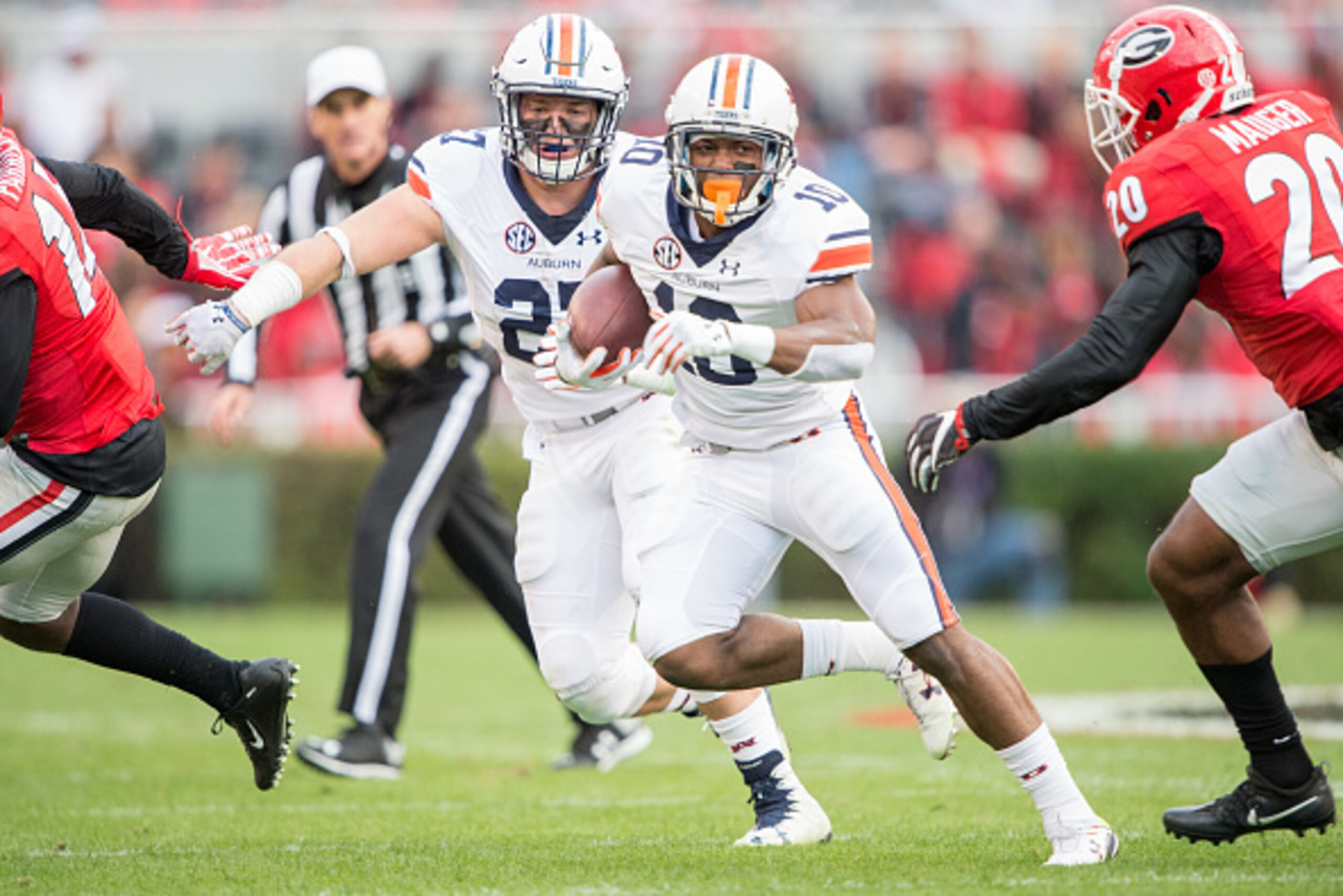 ATHENS, GA - NOVEMBER 12: Wide receiver Stanton Truitt #10 of the Auburn Tigers looks to run the ball by safety Quincy Mauger #20 of the Georgia Bulldogs at Sanford Stadium on November 12, 2016 in Athens, Georgia. (Photo by Michael Chang/Getty Images)