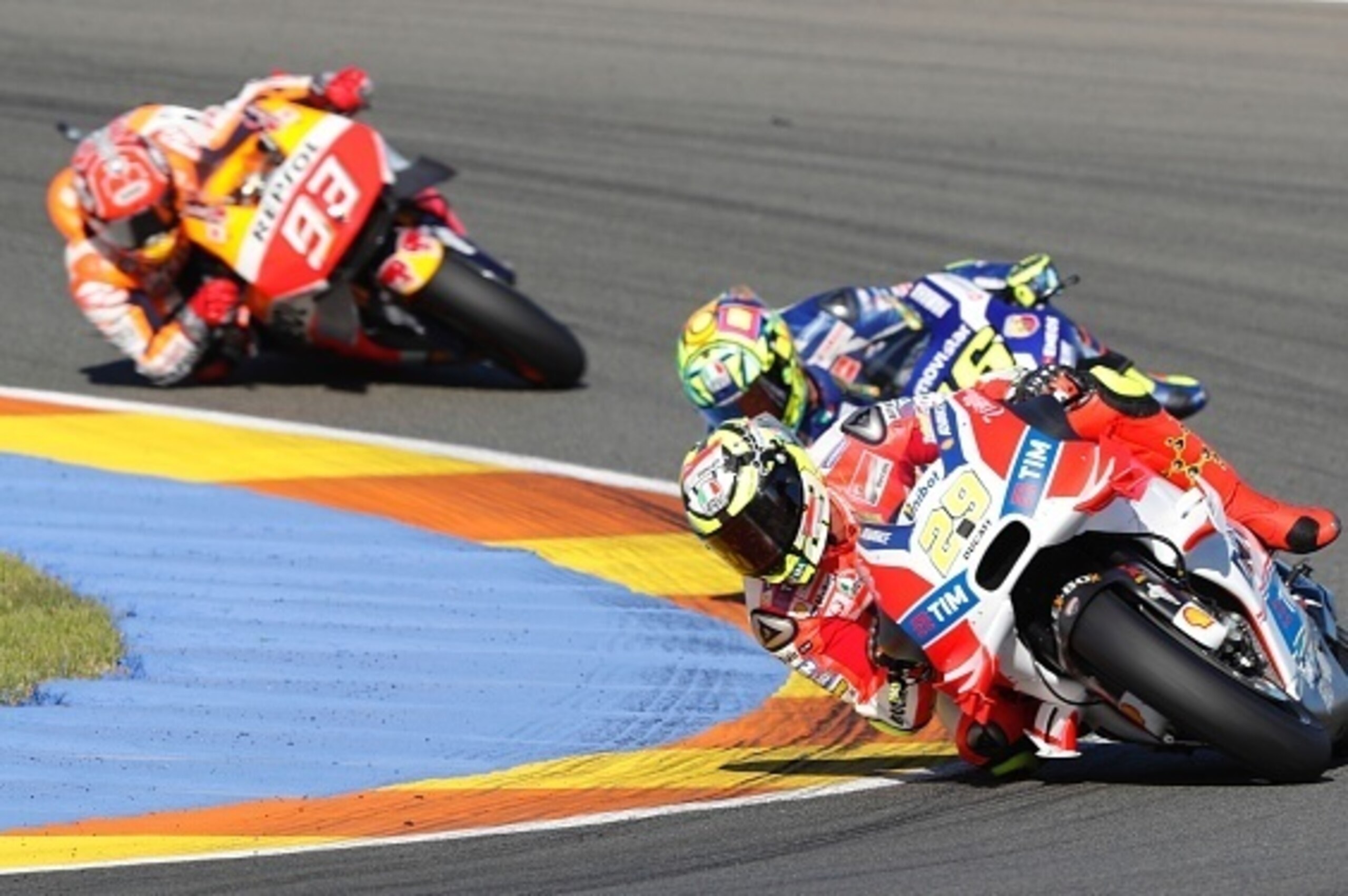 (LtoR) Repsol Honda Team's Spanish rider Marc Marquez, Movistar Yamaha MotoGP's Italian rider Valentino Rossi and Ducati Team's Italian rider Andrea Iannone compete during the MotoGP race of the Motul Comunidad Valenciana Grand Prix at the Ricardo Tormo r