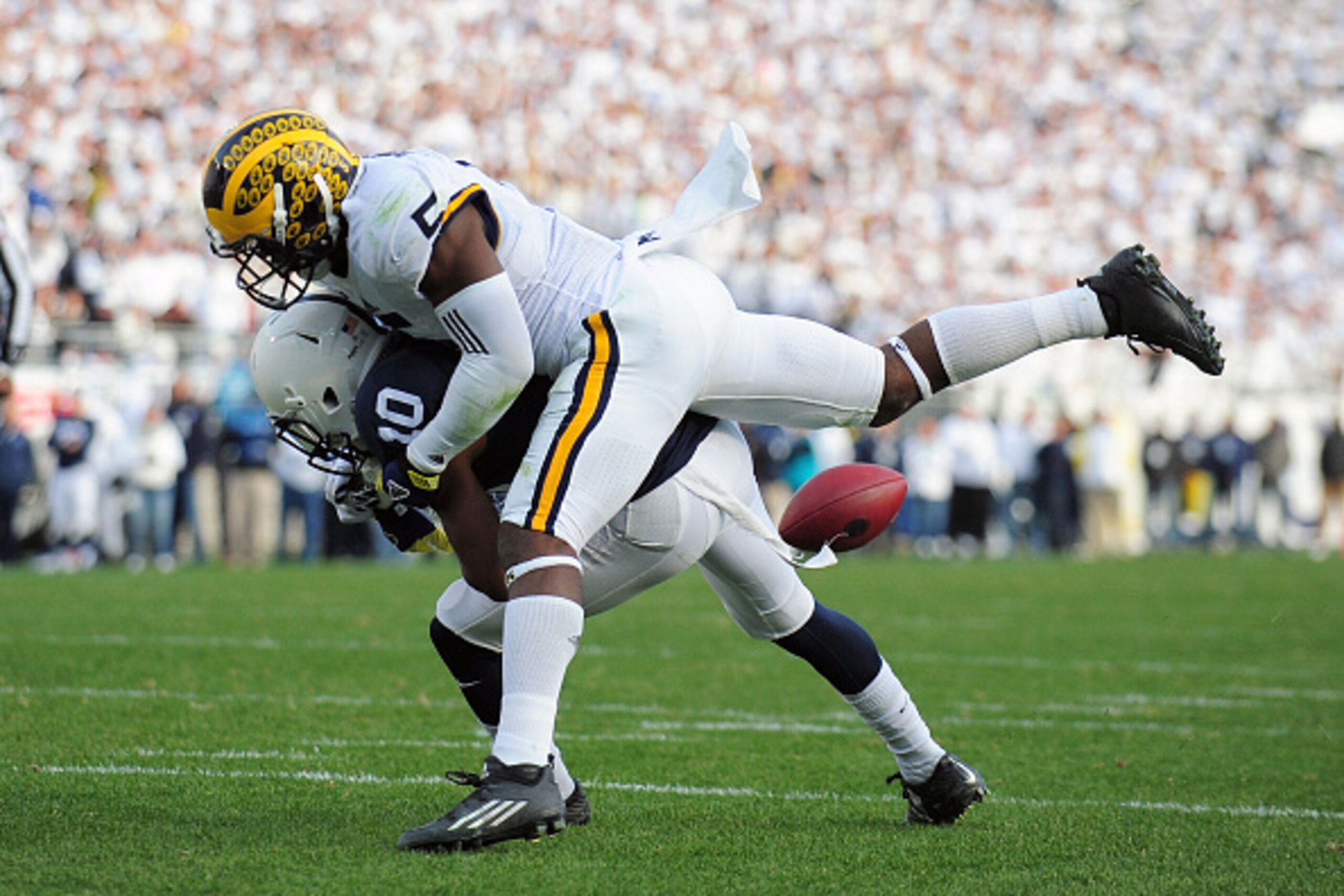 STATE COLLEGE, PA - NOVEMBER 21:  Brandon Polk #10 of the Penn State Nittany Lions has the ball knocked away by Jabril Peppers #5 of the Michigan Wolverines in the fourth quarter at Beaver Stadium on November 21, 2015 in State College, Pennsylvania.  (Pho