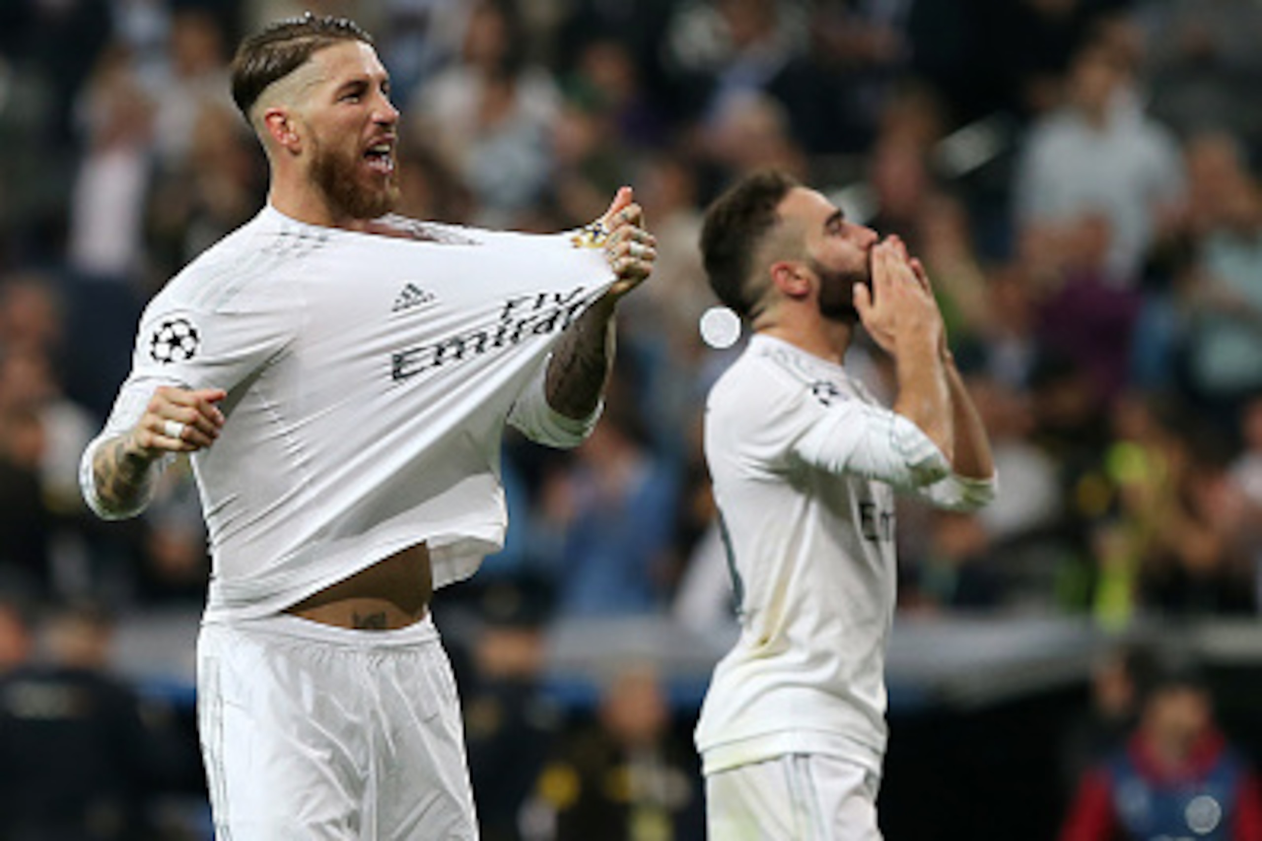 Real Madrid's defender Sergio Ramos (L) and Real Madrid's defender Dani Carvajal celebrate their victory at the end the UEFA Champions League semi-final second leg football match Real Madrid CF vs Manchester City FC at the Santiago Bernabeu stadium in Mad