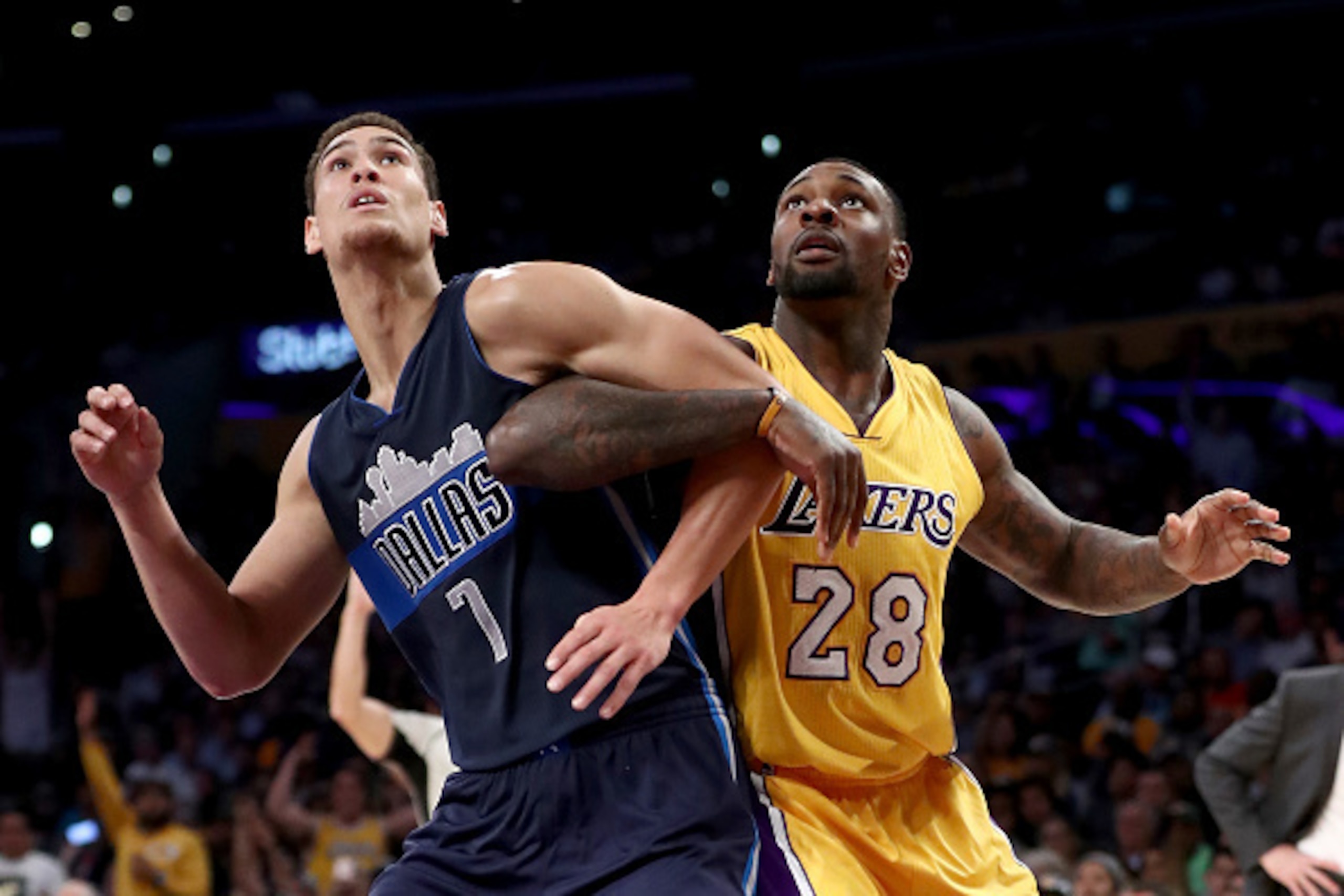 LOS ANGELES, CA - NOVEMBER 08:  Dwight Powell #7 of the Dallas Mavericks and Tarik Black #28 of the Los Angeles Lakers push for position during the second half of a game at Staples Center on November 8, 2016 in Los Angeles, California.NOTE TO USER: User e