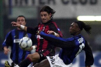 7 Jan 2001:  Francesco Coco of Milan battles with Clarence Seedorf of Inter during the AC Milan v Inter Milan Serie A match played at the Guiseppe Meazza in Milan, Italy. Digital Image. Mandatory Credit: Grazia Neri/ALLSPORT
