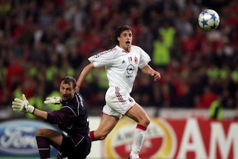 ISTANBUL, TURKEY - MAY 25:  AC Milan forward Hernan Crespo of Argentina scores the third goal past Liverpool goalkeeper Jerzy Dudek of Poland during the European Champions League final between Liverpool and AC Milan on May 25, 2005 at the Ataturk Olympic 
