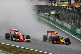 SAO PAULO, BRAZIL - NOVEMBER 13:  Max Verstappen of the Netherlands driving the (33) Red Bull Racing Red Bull-TAG Heuer RB12 TAG Heuer overtakes Kimi Raikkonen of Finland driving the (7) Scuderia Ferrari SF16-H Ferrari 059/5 turbo (Shell GP) on track duri