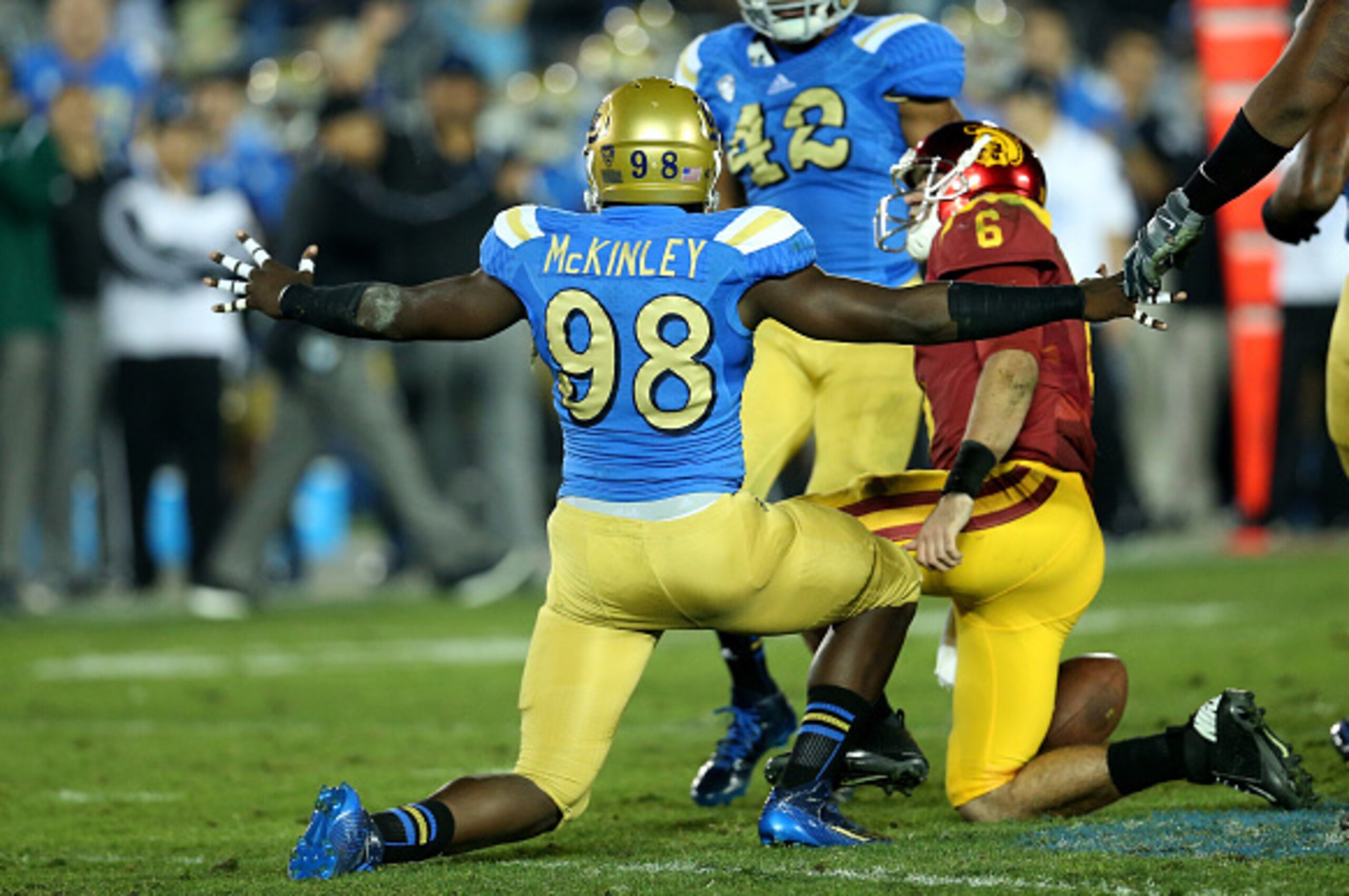PASADENA, CA - NOVEMBER 22:  Takkarist McKinley #98 of the UCLA Bruins celebrates after sacking quarterback Cody Kessler #6 of the USC Trojans in the third quarter at the Rose Bowl on November 22, 2014 in Pasadena, California.   UCLA on 38-20.  (Photo by 