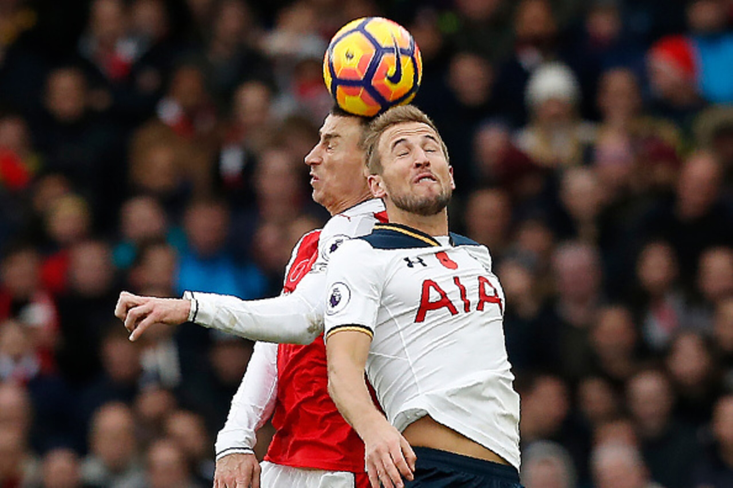 Arsenal's French defender Laurent Koscielny (L) vies in the air with Tottenham Hotspur's English striker Harry Kane during the English Premier League football match between Arsenal and Tottenham Hotspur at the Emirates Stadium in London on November 6, 201