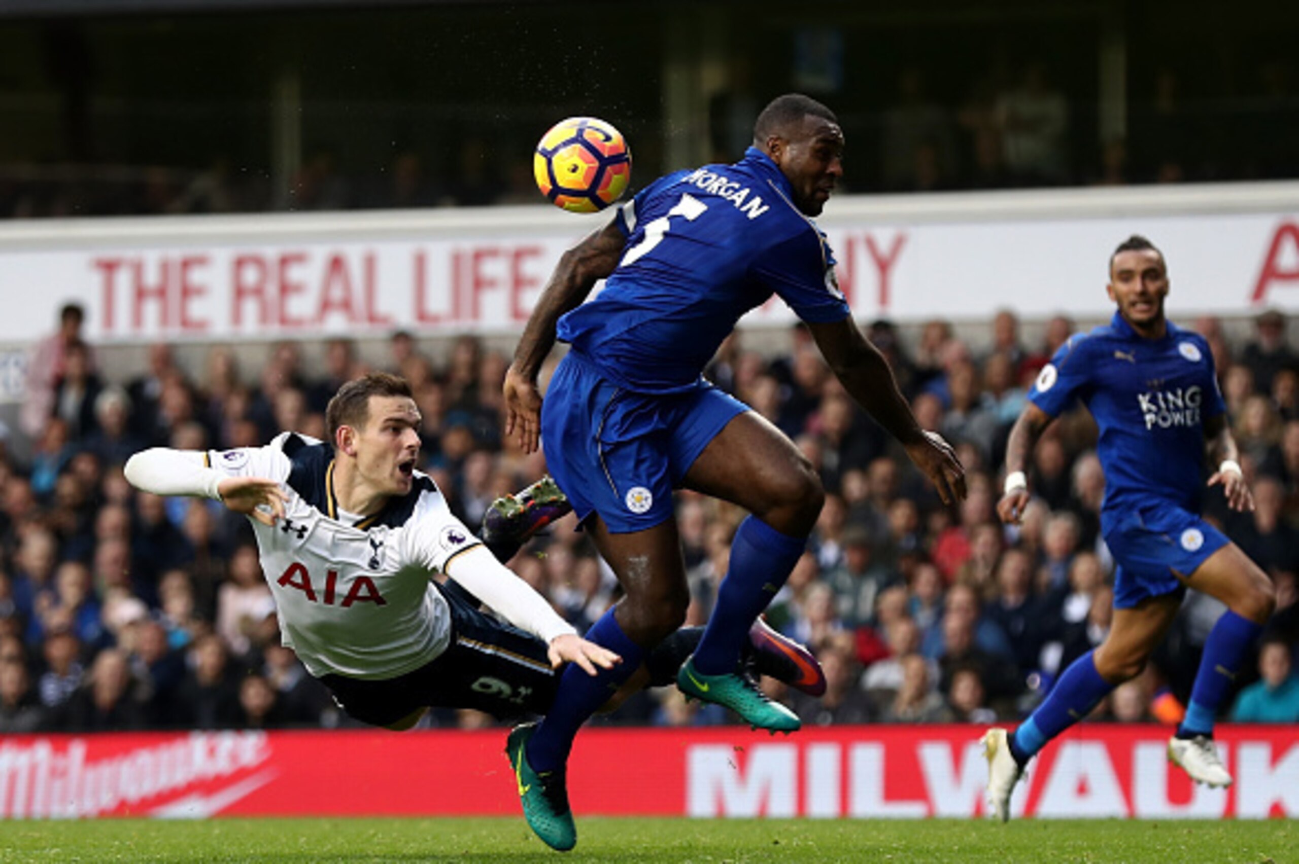 LONDON, ENGLAND - OCTOBER 29: Vincent Janssen of Tottenham Hotspur (L) heads towards goal while Wes Morgan of Leicester City (C) attempts to block during the Premier League match between Tottenham Hotspur and Leicester City at White Hart Lane on October 2