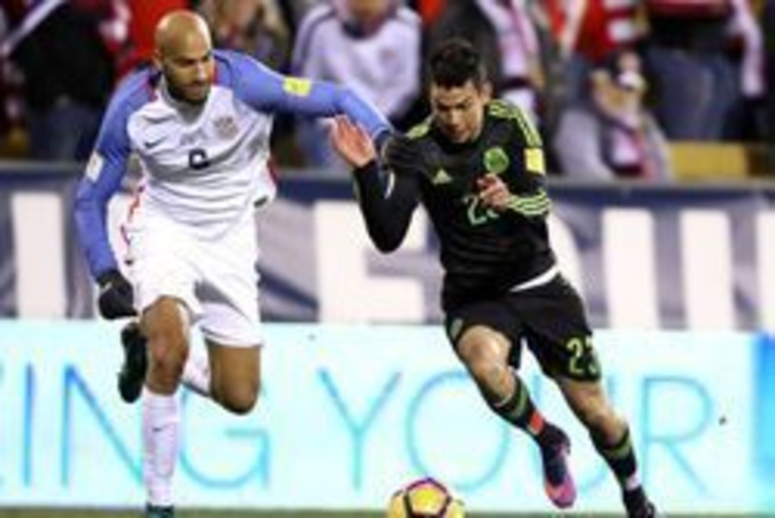 Nov 11, 2016; Columbus, OH, USA; USA forward Alan Gordon (8) defends Mexico forward Hirving Lozano (23) during the second half at MAPFRE Stadium.  Mexico won the game 2-1. Mandatory Credit: Joe Maiorana-USA TODAY Sports