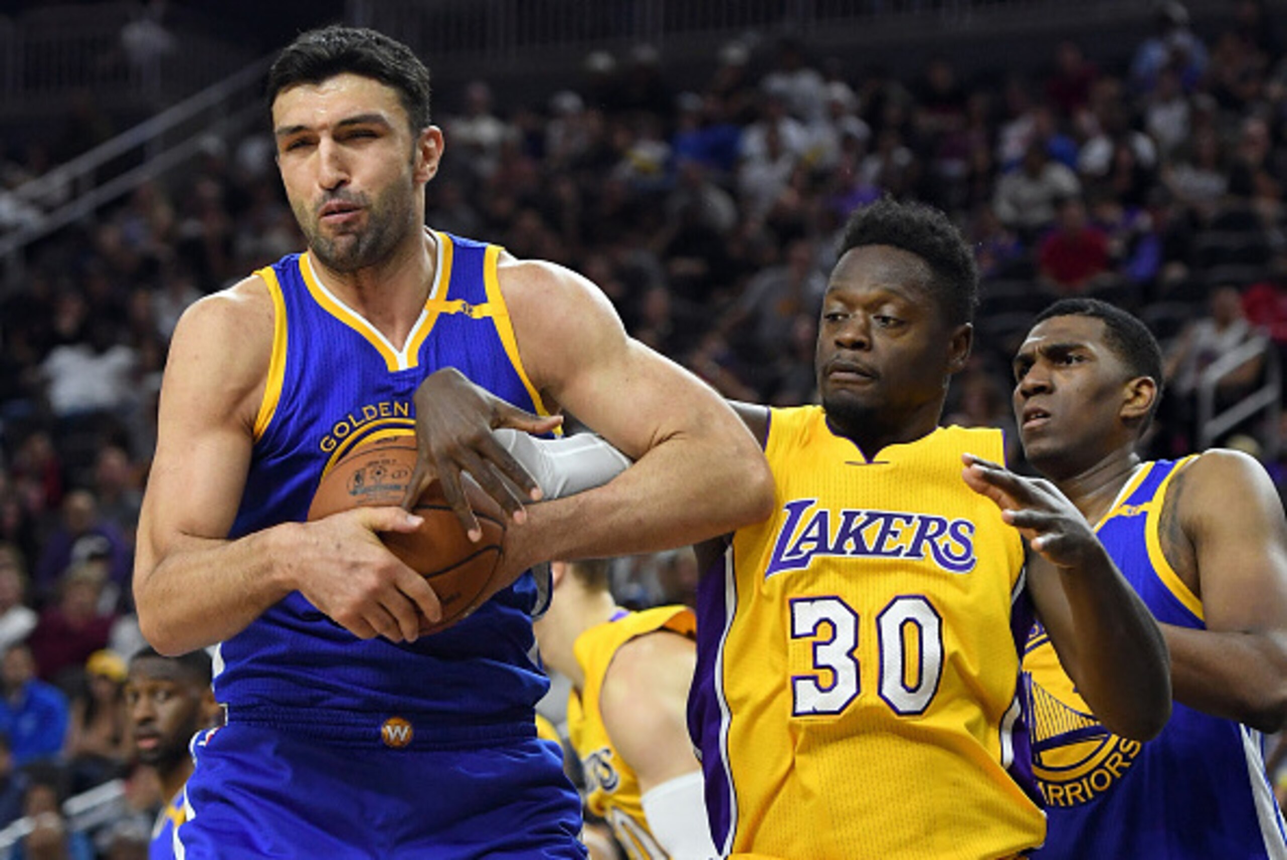 LAS VEGAS, NV - OCTOBER 15: Zaza Pachulia #27 of the Golden State Warriors and Julius Randle #30 of the Los Angeles Lakers fight for a rebound during their preseason game at T-Mobile Arena on October 15, 2016 in Las Vegas, Nevada. NOTE TO USER: User expr LAS VEGAS, NV - OCTOBER 15: Zaza Pachulia #27 of the Golden State Warriors and Julius Randle #30 of the Los Angeles Lakers fight for a rebound during their preseason game at T-Mobile Arena on October 15, 2016 in Las Vegas, Nevada. NOTE TO USER: User expr