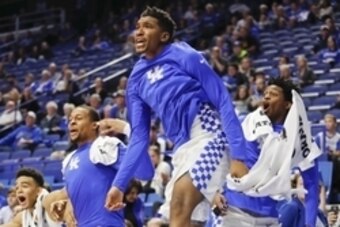 Nov 6, 2016; Lexington, KY, USA; Kentucky Wildcats guard Malik Monk (5) guard De'Aaron Fox (0) and guard Isaiah Briscoe (13) celebrate on the sideline during the game against the Asbury Eagles in the second half at Rupp Arena. Kentucky defeated Asbury 156