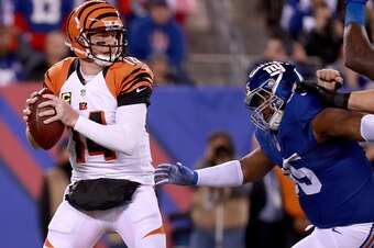 EAST RUTHERFORD, NJ - NOVEMBER 14:  Andy Dalton #14 of the Cincinnati Bengals looks to throw a pass against the New York Giants during the first half of the game at MetLife Stadium on November 14, 2016 in East Rutherford, New Jersey.  (Photo by Michael Re