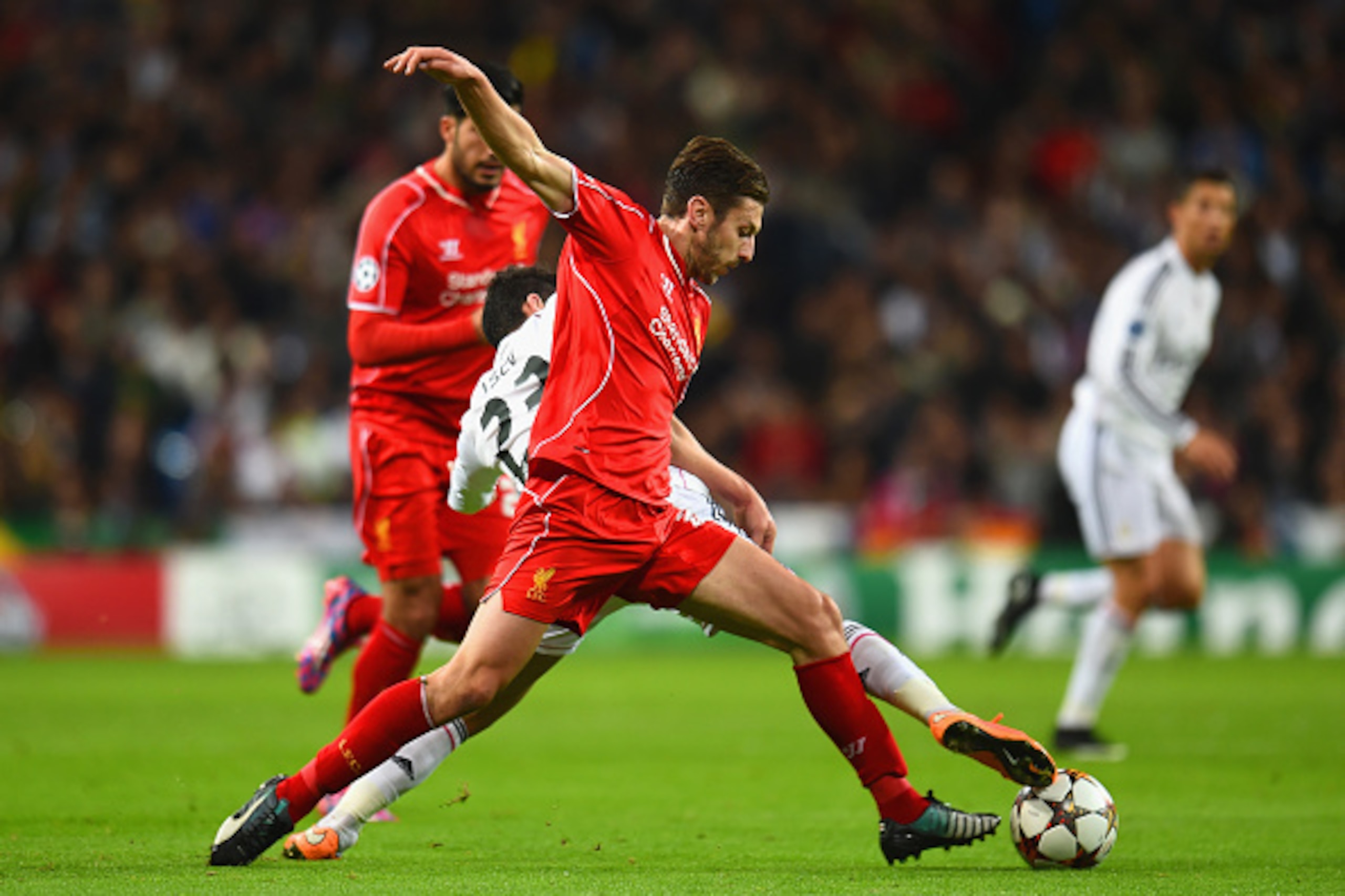 MADRID, SPAIN - NOVEMBER 04: Adam Lallana of Liverpool and Isco of Real Madrid CF battle for the ball during the UEFA Champions League Group B match between Real Madrid CF and Liverpool FC at Estadio Santiago Bernabeu on November 4, 2014 in Madrid, Spain MADRID, SPAIN - NOVEMBER 04: Adam Lallana of Liverpool and Isco of Real Madrid CF battle for the ball during the UEFA Champions League Group B match between Real Madrid CF and Liverpool FC at Estadio Santiago Bernabeu on November 4, 2014 in Madrid, Spain
