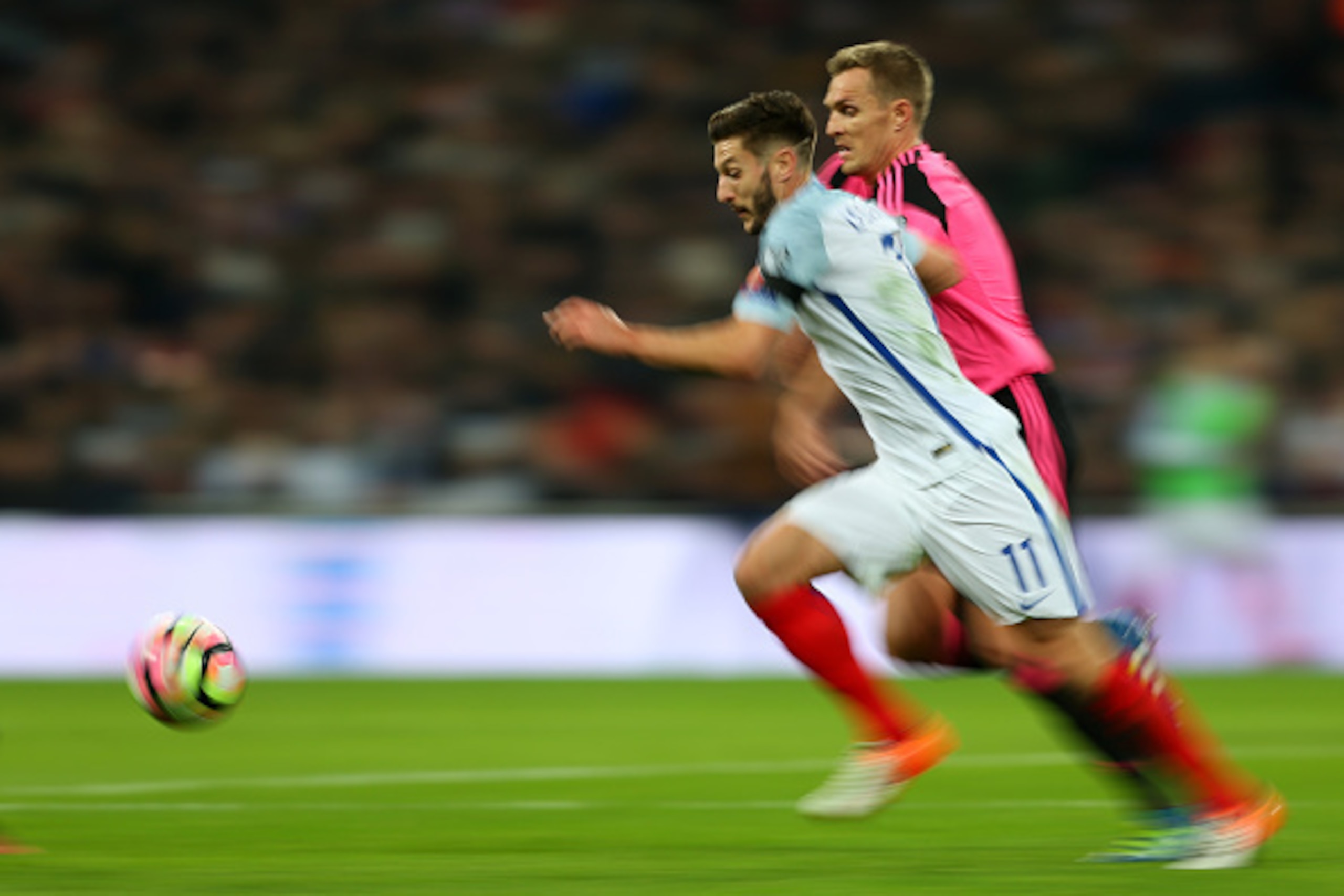 LONDON, ENGLAND - NOVEMBER 11: Motion blur of Adam Lallana of England and Darren Fletcher of Scotland during the FIFA 2018 World Cup Qualifier between England and Scotland at Wembley Stadium on November 11, 2016 in London, England. (Photo by Catherine Iv LONDON, ENGLAND - NOVEMBER 11: Motion blur of Adam Lallana of England and Darren Fletcher of Scotland during the FIFA 2018 World Cup Qualifier between England and Scotland at Wembley Stadium on November 11, 2016 in London, England. (Photo by Catherine Iv
