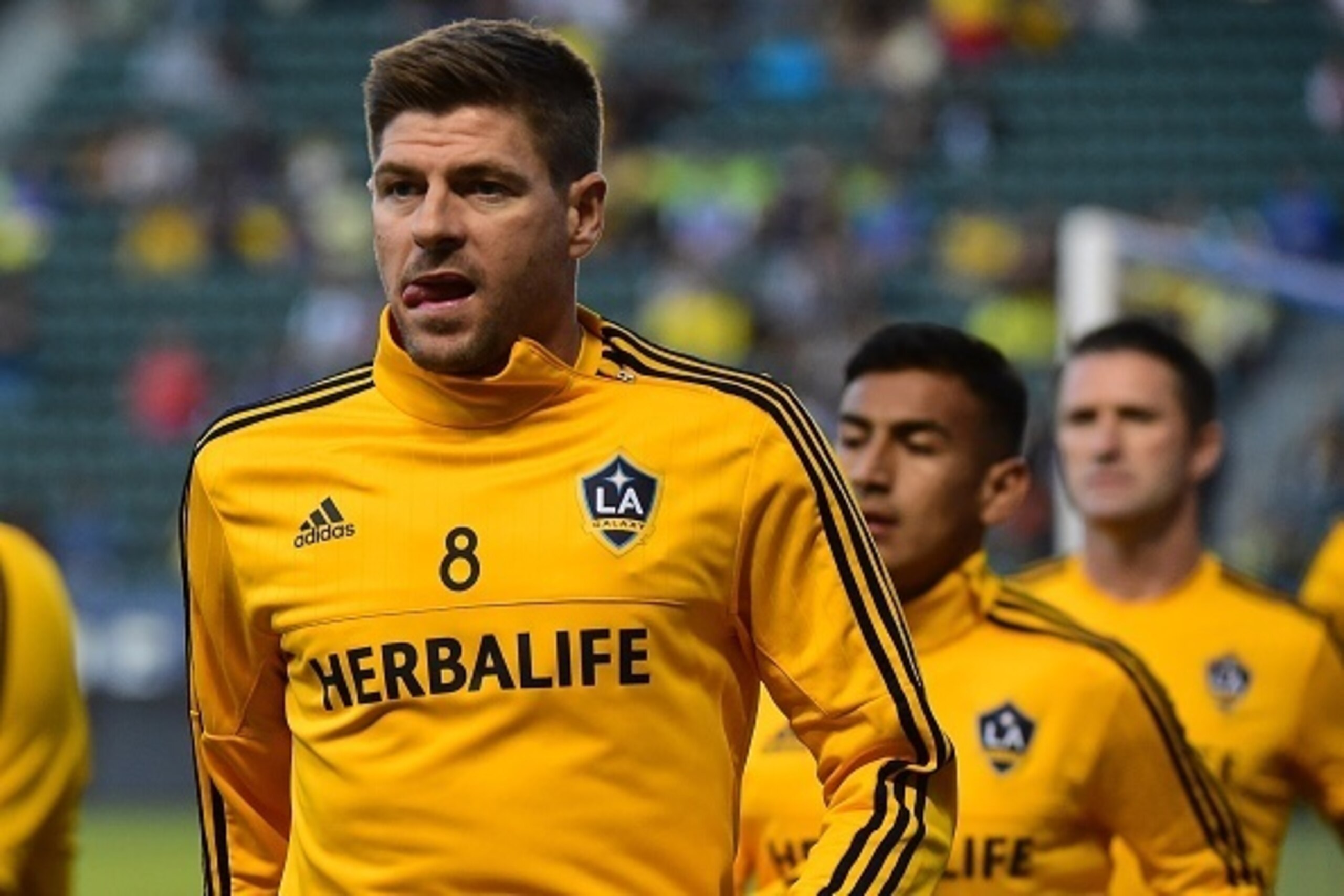 Steven Gerrard of the LA Galaxy warms up with teammates before making his debut for the MLS side against Club America on July 11, 2015 in their 2015 International Champions Cup match in Carson, California. The LA Galaxy defeated Club America 2-1.    AFP P
