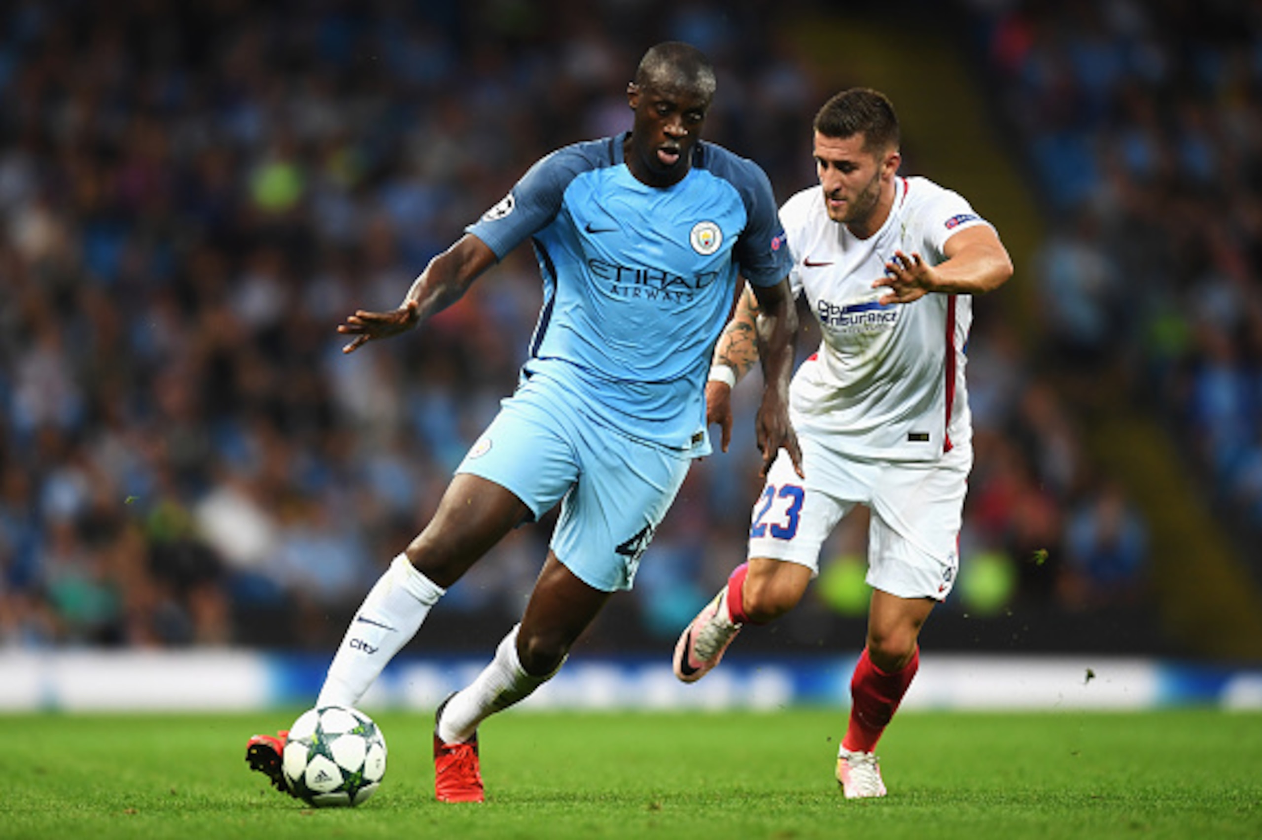 MANCHESTER, ENGLAND - AUGUST 24: Yaya Toure of Manchester City is closed down by Ovidiu Popescu of Steaua Bucharest during the UEFA Champions League Play-off Second Leg match between Manchester City and Steaua Bucharest at Etihad Stadium on August 24, 20 MANCHESTER, ENGLAND - AUGUST 24: Yaya Toure of Manchester City is closed down by Ovidiu Popescu of Steaua Bucharest during the UEFA Champions League Play-off Second Leg match between Manchester City and Steaua Bucharest at Etihad Stadium on August 24, 20