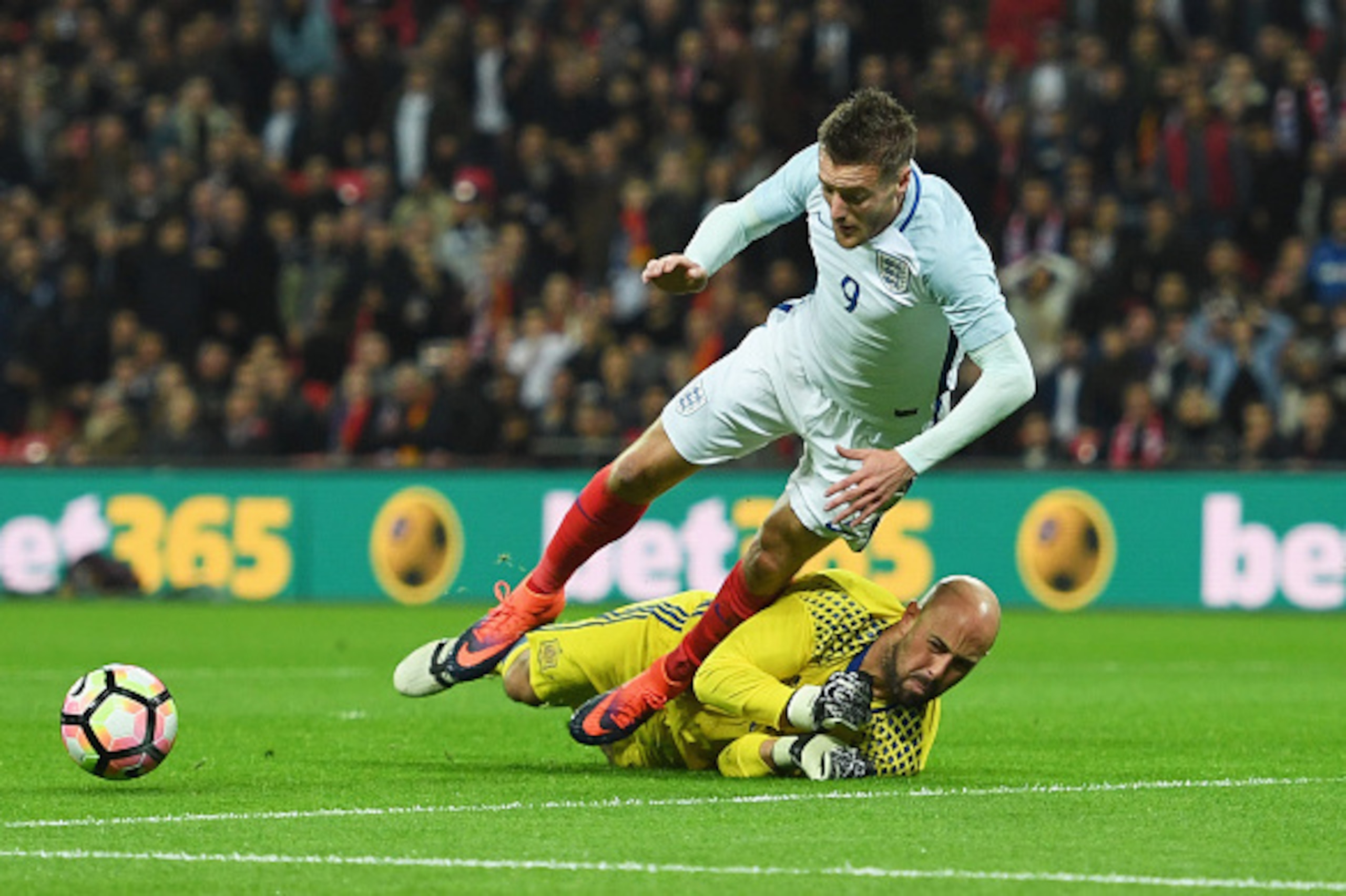 LONDON, ENGLAND - NOVEMBER 15:  Pepe Reina of Spain fouls Jamie Vardy of England to concede a penalty during the international friendly match between England and Spain at Wembley Stadium on November 15, 2016 in London, England.  (Photo by Shaun Botterill/