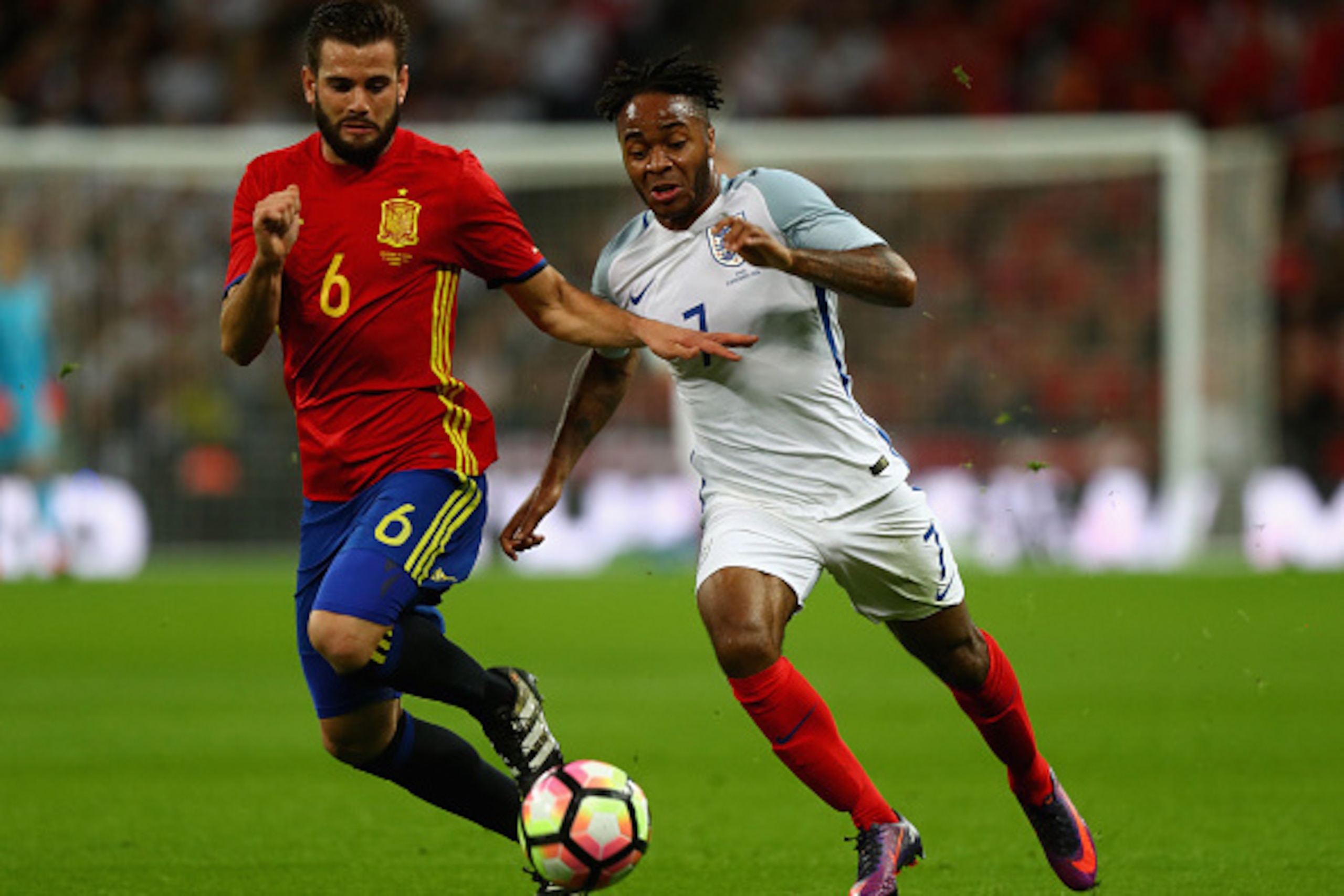 LONDON, ENGLAND - NOVEMBER 15:  Nacho of Spain and Raheem Sterling of England battle for the ball during the international friendly match between England and Spain at Wembley Stadium on November 15, 2016 in London, England.  (Photo by Clive Rose/Getty Ima