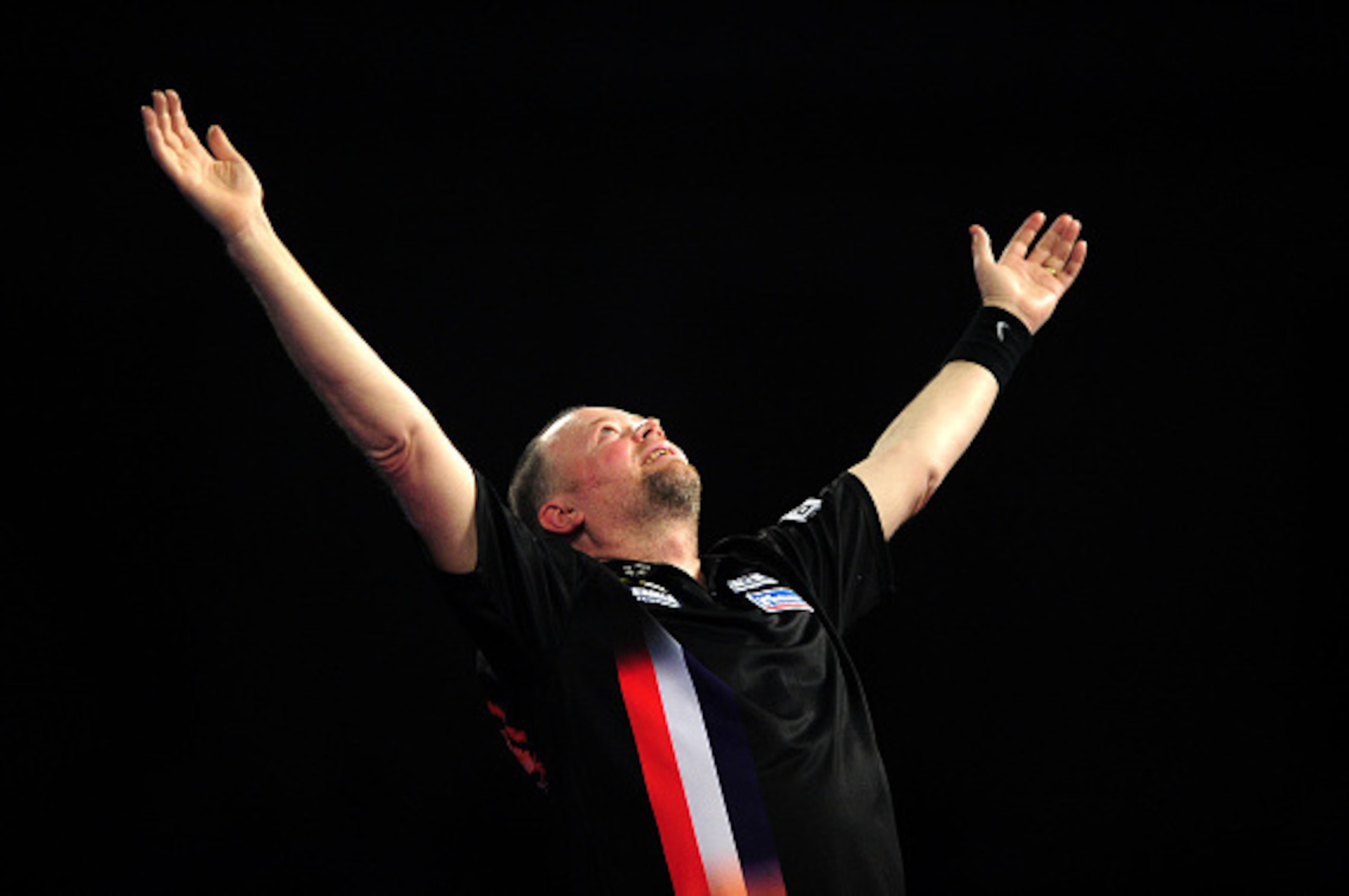LONDON, ENGLAND - JANUARY 01:  Raymond van Barneveld of the Netherlands celebrates victory over Michael Smith of England in their quarter final match during Day Thirteen of the 2016 William Hill PDC World Darts Championships at Alexandra Palace on January