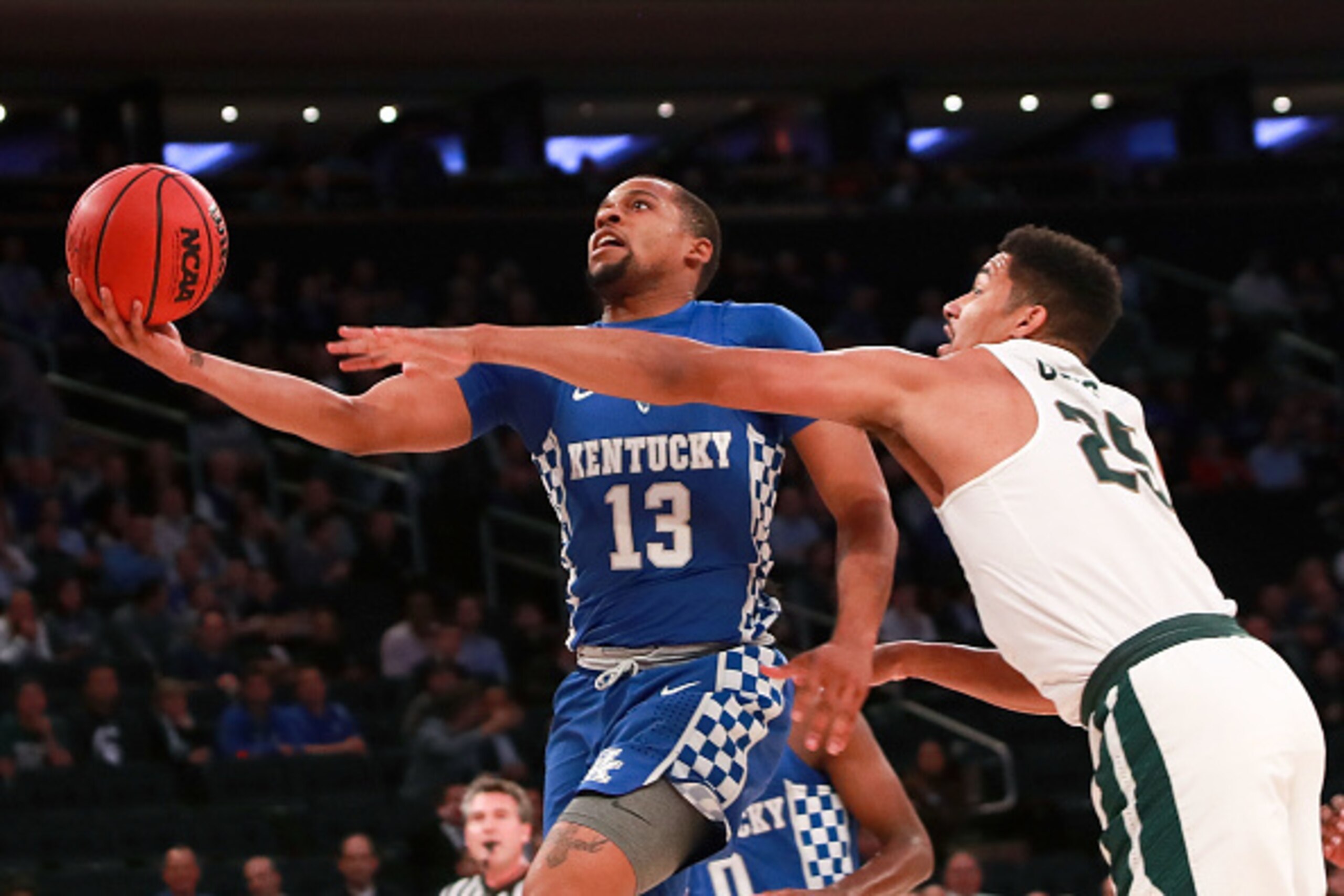 NEW YORK, NY - NOVEMBER 15:  Isaiah Briscoe #13 of the Kentucky Wildcats puts up a shot against Kenny Goins #25 of the Michigan State Spartans in the first half during the State Farm Champions Classic at Madison Square Garden on November 15, 2016 in New Y