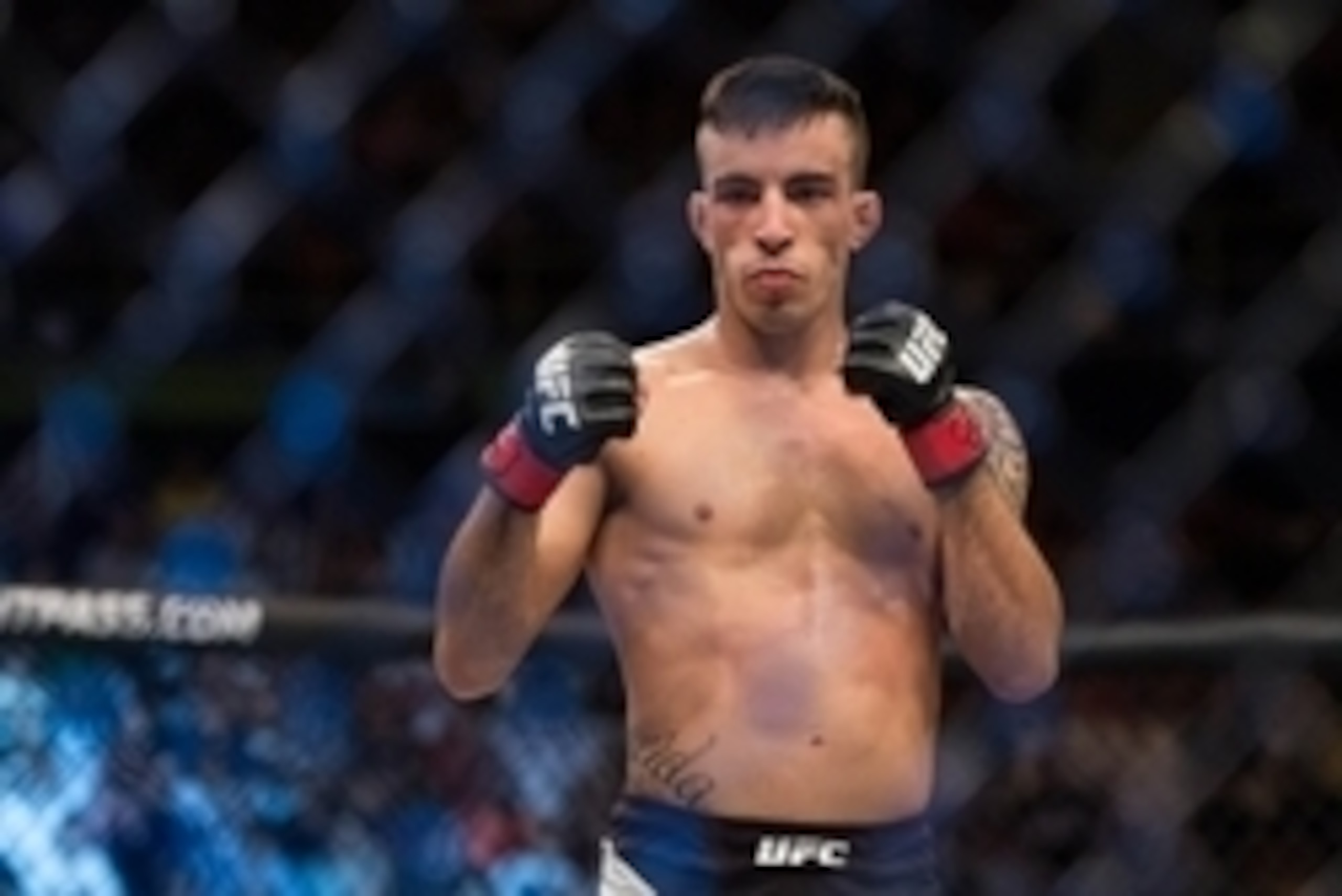 Nov 7, 2015; Sao Paulo, Brazil;  Thomas Almeida (red gloves) reacts after defeating Anthony Birchak (blue gloves) during UFC Fight Night at Ibirapuera Gymnasium. Mandatory Credit: Jason Silva-USA TODAY Sports