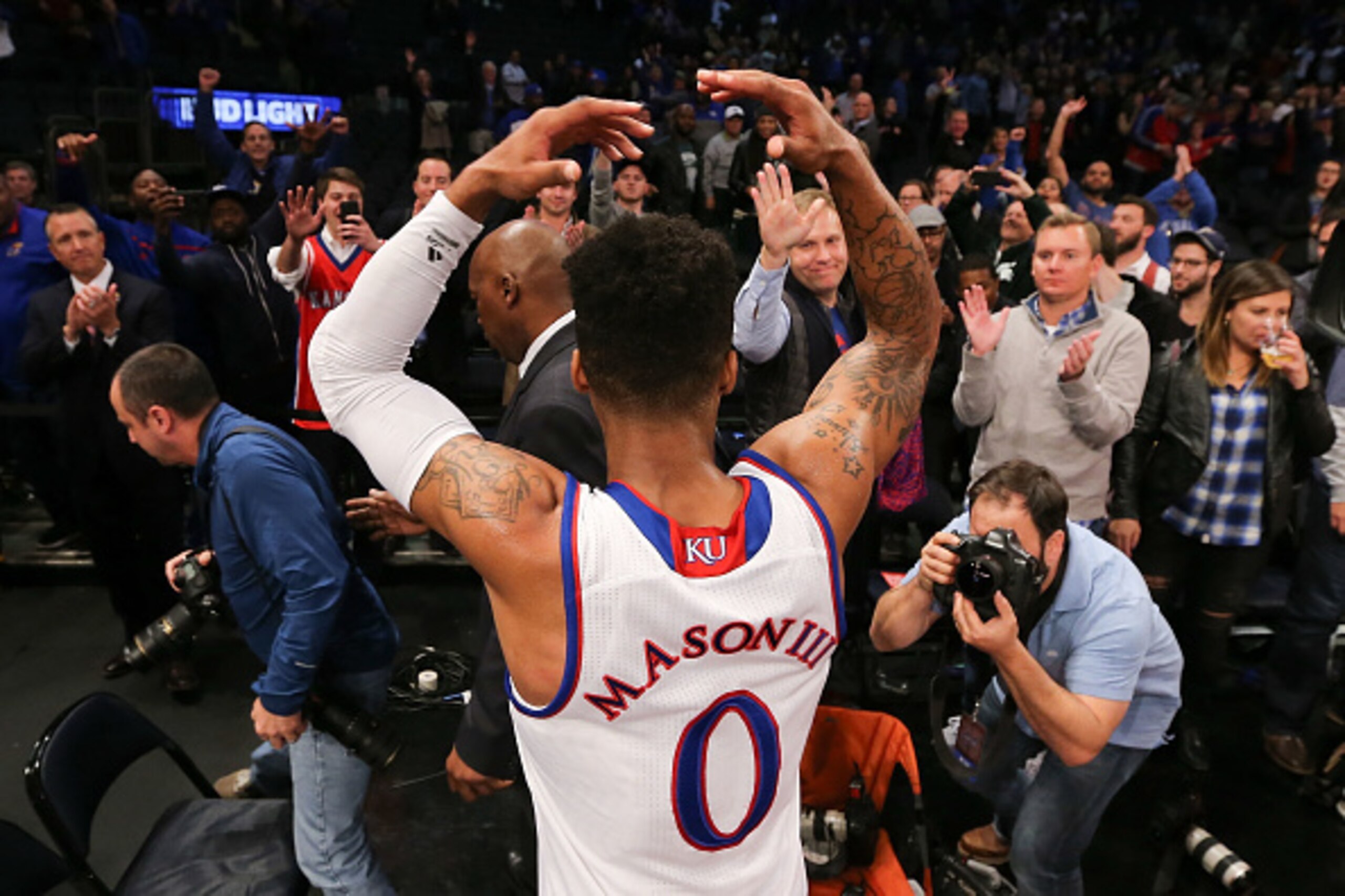 NEW YORK, NY - NOVEMBER 15:  Frank Mason III #0 of the Kansas Jayhawks celebrates after hitting a game-winning shot with 1.8 seconds remaining against the Duke Blue Devils in the second half during the State Farm Champions Classic at Madison Square Garden