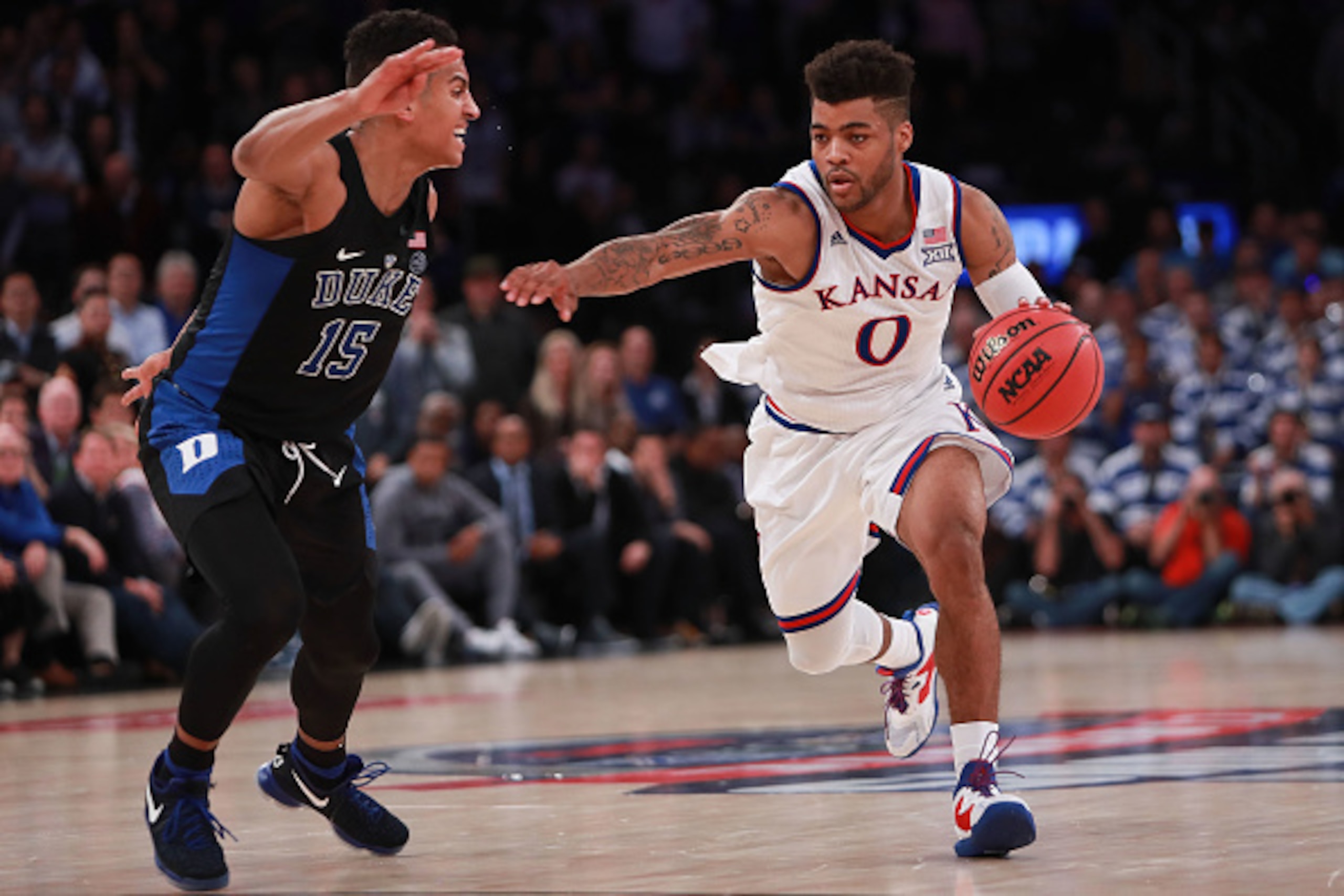 NEW YORK, NY - NOVEMBER 15:  Frank Mason III #0 of the Kansas Jayhawks drives to the basket against Frank Jackson #15 of the Duke Blue Devils in the second half during the State Farm Champions Classic at Madison Square Garden on November 15, 2016 in New Y