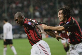 MILAN, ITALY - MAY 02:  Clarence Seedorf of AC Milan celebrates with Andrea Pirlo after scoring their second goal during the UEFA Champions League semi final, second leg match between AC Milan and Manchester United at the San Siro stadium on May 2, 2007 i