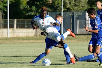 GORIZIA, ITALY - AUGUST 24:  Bioty Moise Kean (L) of Italy U16 in action during the International Friendly between Italy U16 and Bosnia U16 at Stadio Enzo Bearzot on August 24, 2016 in Gorizia, Italy.  (Photo by Dino Panato/Getty Images)