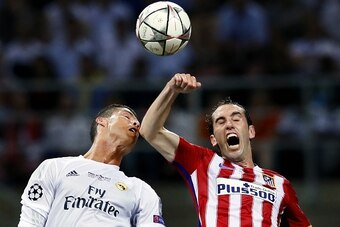 (L-R) Cristiano Ronaldo of Real Madrid, Juanfran of Atletico Madrid during the UEFA Champions League final match between Real Madrid and Atletico Madrid on May 28, 2016 at the Giuseppe Meazza San Siro stadium in Milan, Italy.(Photo by VI Images via Getty 