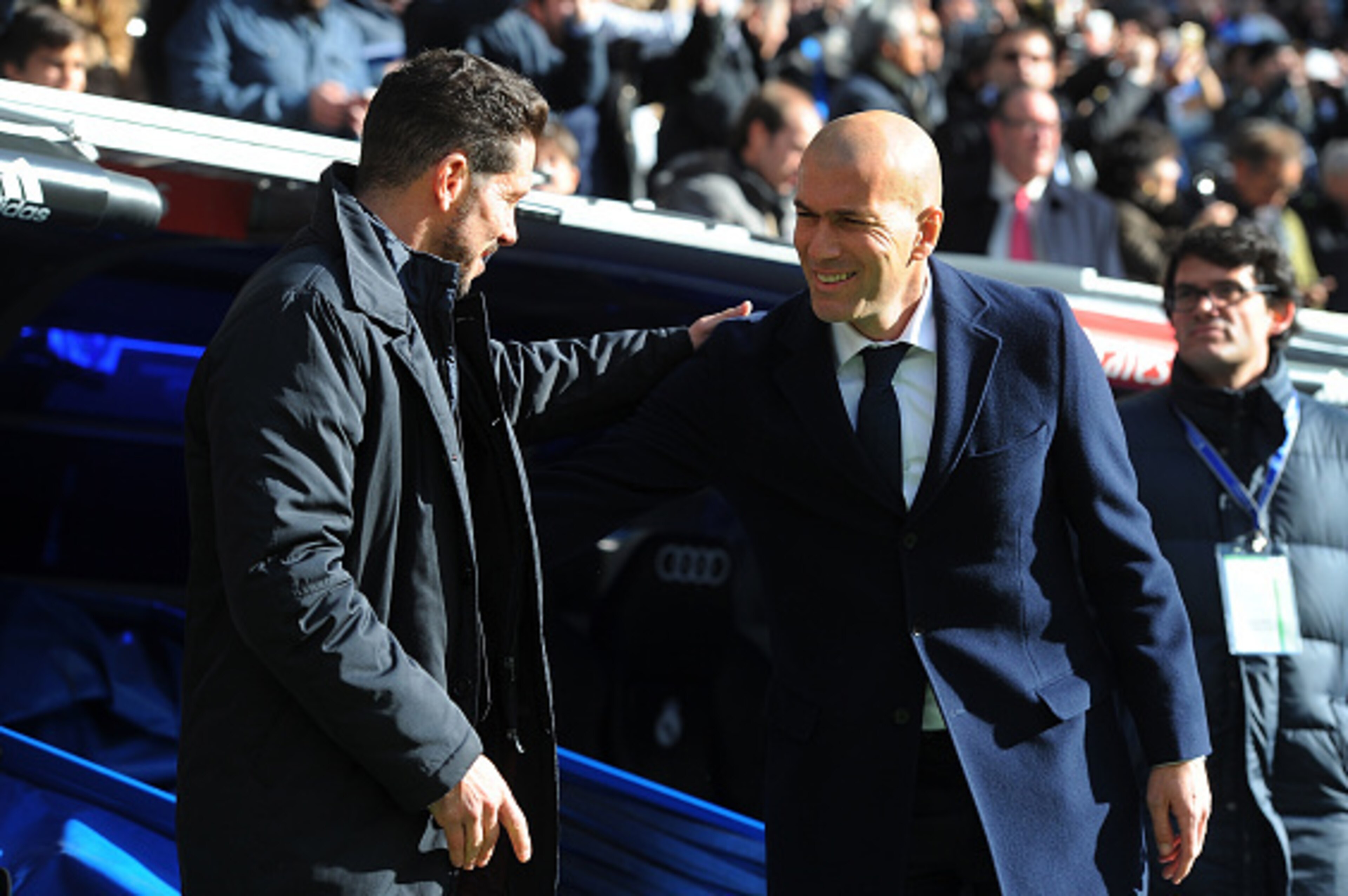 MADRID, SPAIN - FEBRUARY 27:  Manager Diego Simeone of Club Atletico de Madrid greets Real Madrid manager Zinedine Zidane during the La Liga match between Real Madrid CF and Club Atletico de Madrid at Estadio Santiago Bernabeu on February 27, 2016 in Madr
