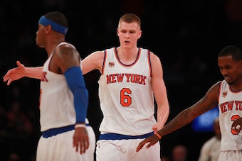 NEW YORK, NY - OCTOBER 10:  Kristaps Porzingis #6 of the New York Knicks celebrates with Carmelo Anthony #7 and Brandon Jennings #3 in the first half of a preseason game at Madison Square Garden on October 10, 2016 in New York City. NOTE TO USER: User exp