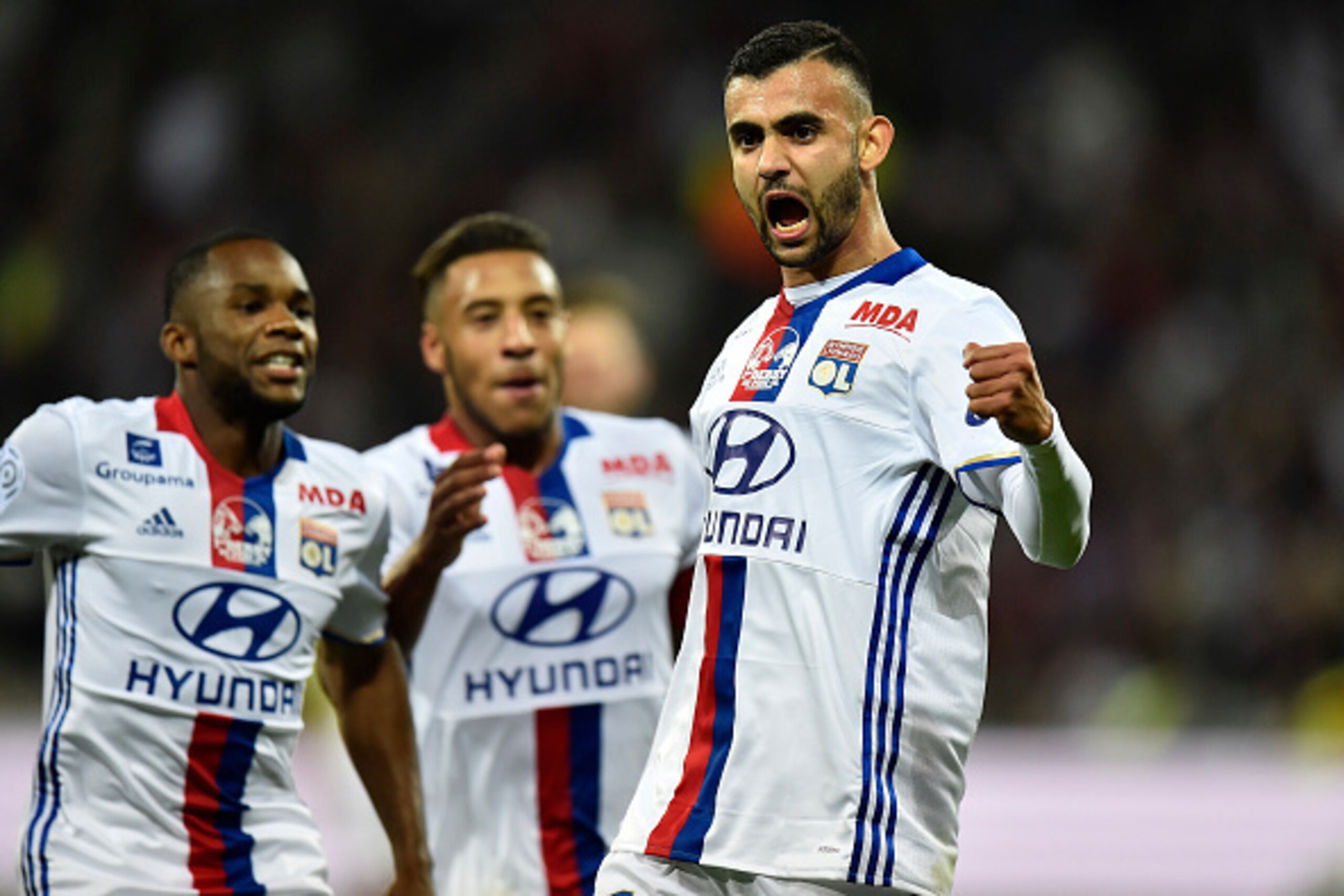 Lyon's Algerian forward Rachid Ghezzal celebrates after scoring a goal during the French L1 football match between Lyon and AS Saint-Etienne at the Parc Olympique Lyonnais in Decines-Charpieu near Lyon, southeastern France, on October 2, 2016. / AFP / ROM