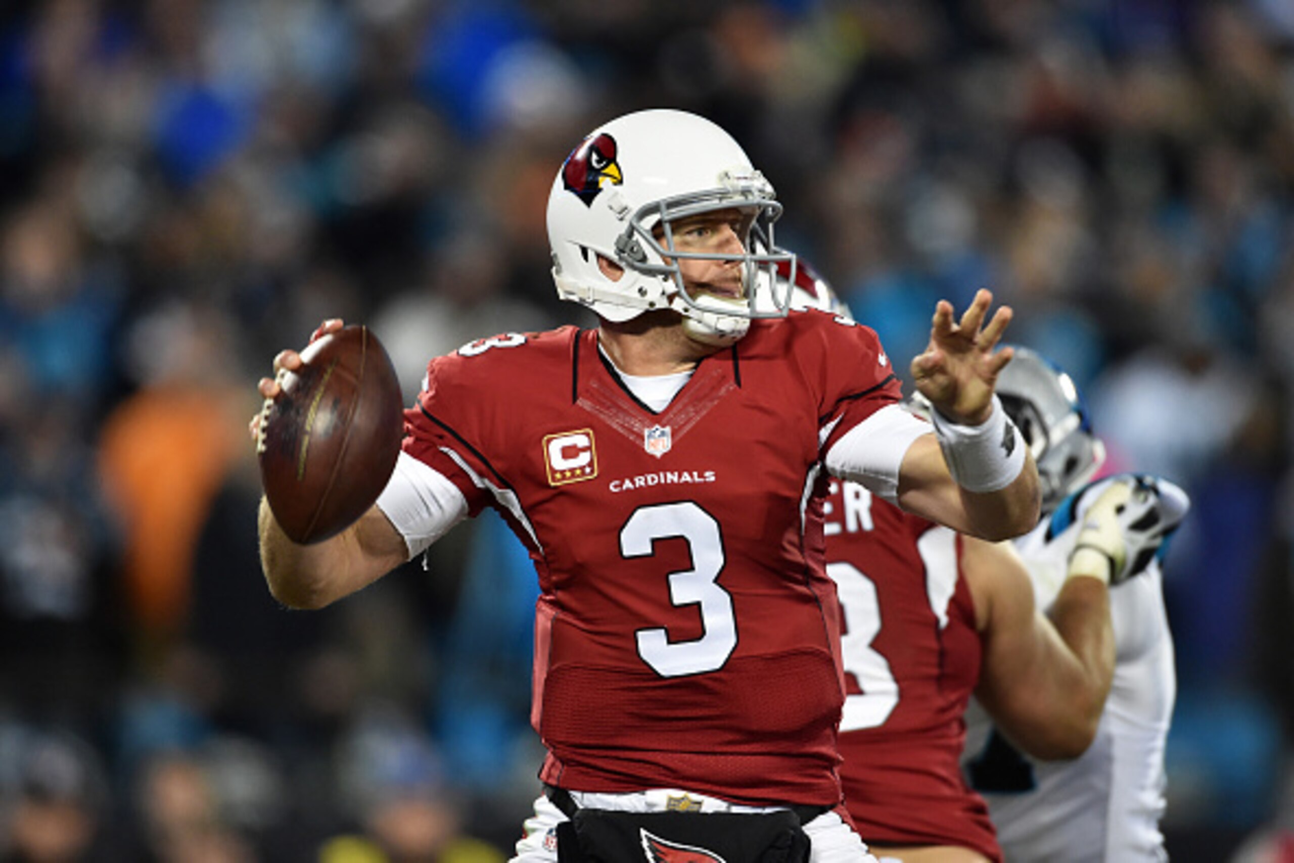 CHARLOTTE, NC - JANUARY 24:  Quarterback Carson Palmer #3 of the Arizona Cardinals looks for a receiver during the NFC Championship Game against the Carolina Panthers at Bank of America Stadium on January 24, 2016 in Charlotte, North Carolina.  (Photo by 