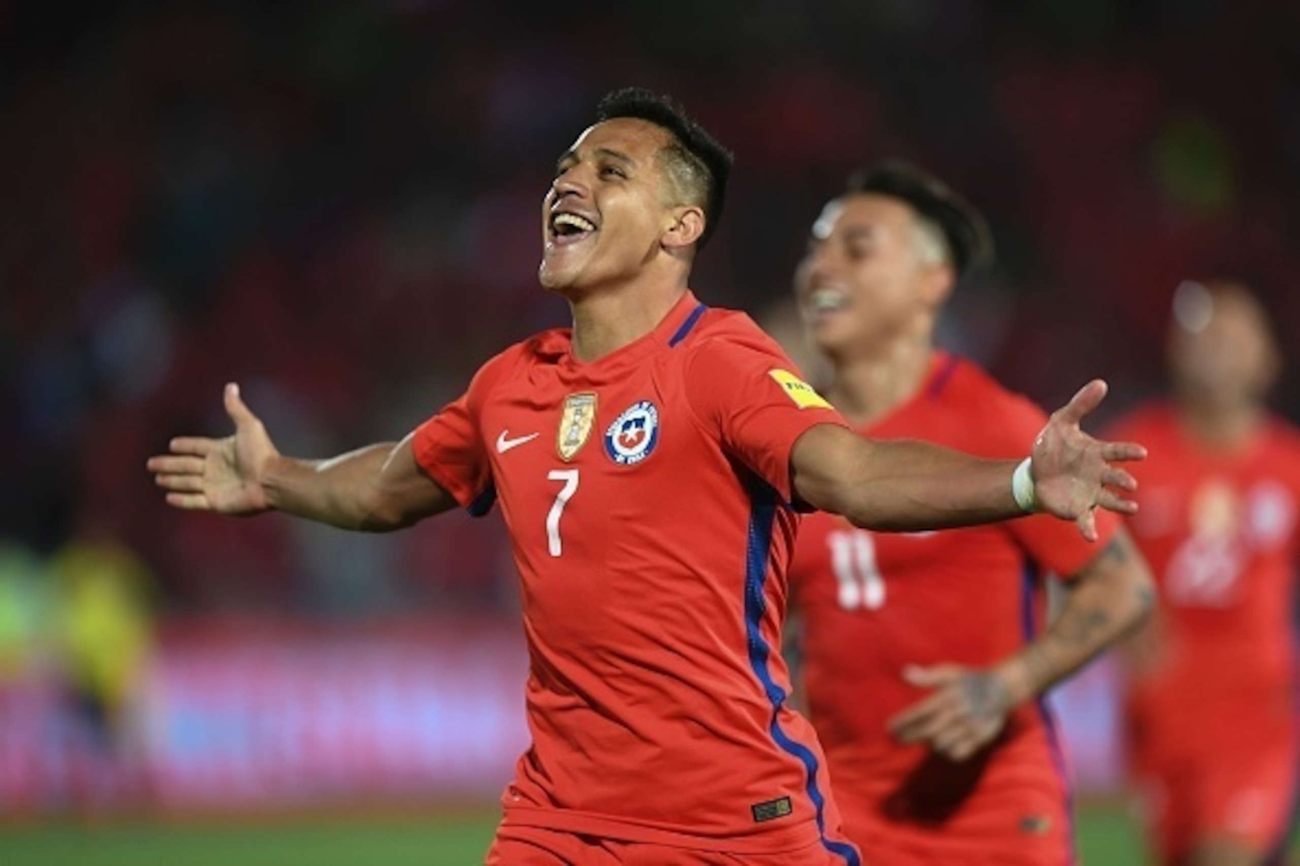 Chile's Alexis Sanchez celebrates after scoring against Uruguay during their 2018 FIFA World Cup qualifier football match in Santiago, on November 15, 2016. / AFP / Martin BERNETTI        (Photo credit should read MARTIN BERNETTI/AFP/Getty Images)