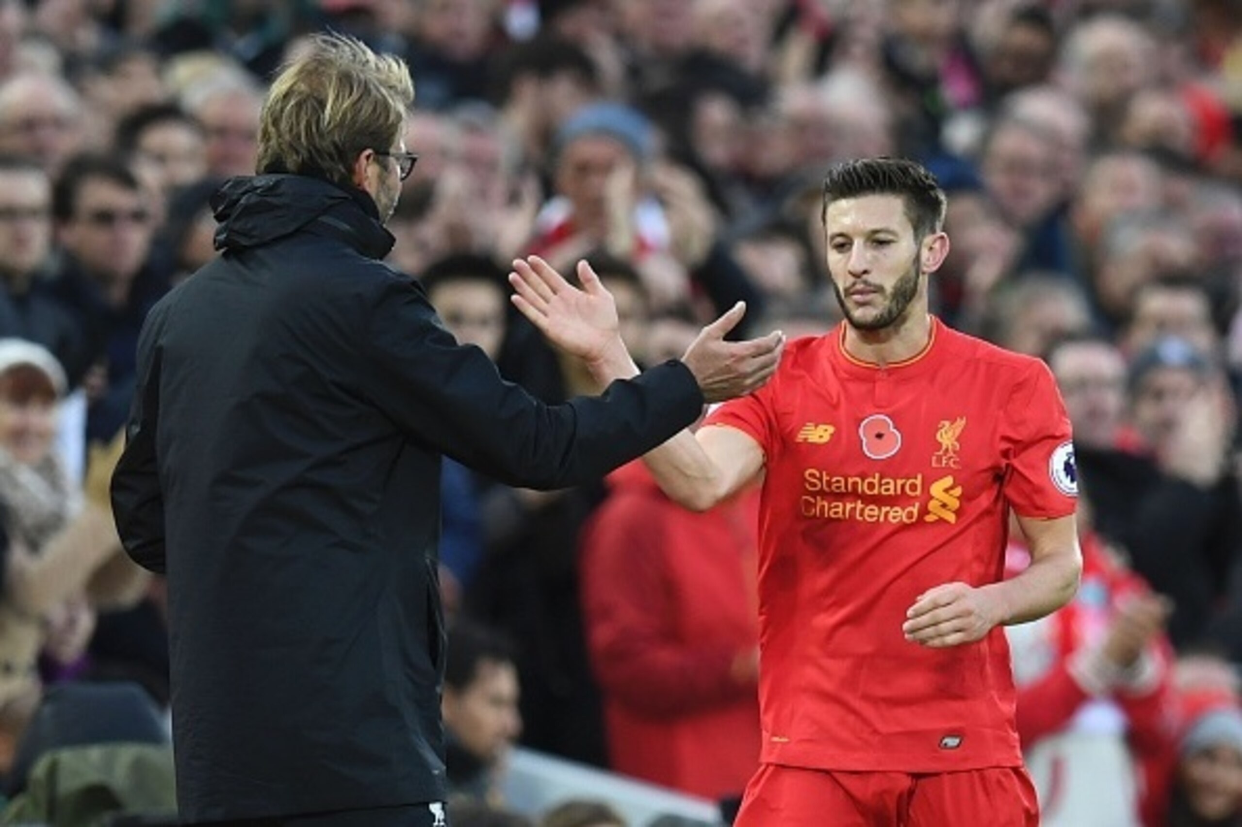 Liverpool's English midfielder Adam Lallana is congratulated by Liverpool's German manager Jurgen Klopp as he is substituted off of the pitch during the English Premier League football match between Liverpool and Watford at Anfield in Liverpool, north wes Liverpool's English midfielder Adam Lallana is congratulated by Liverpool's German manager Jurgen Klopp as he is substituted off of the pitch during the English Premier League football match between Liverpool and Watford at Anfield in Liverpool, north wes