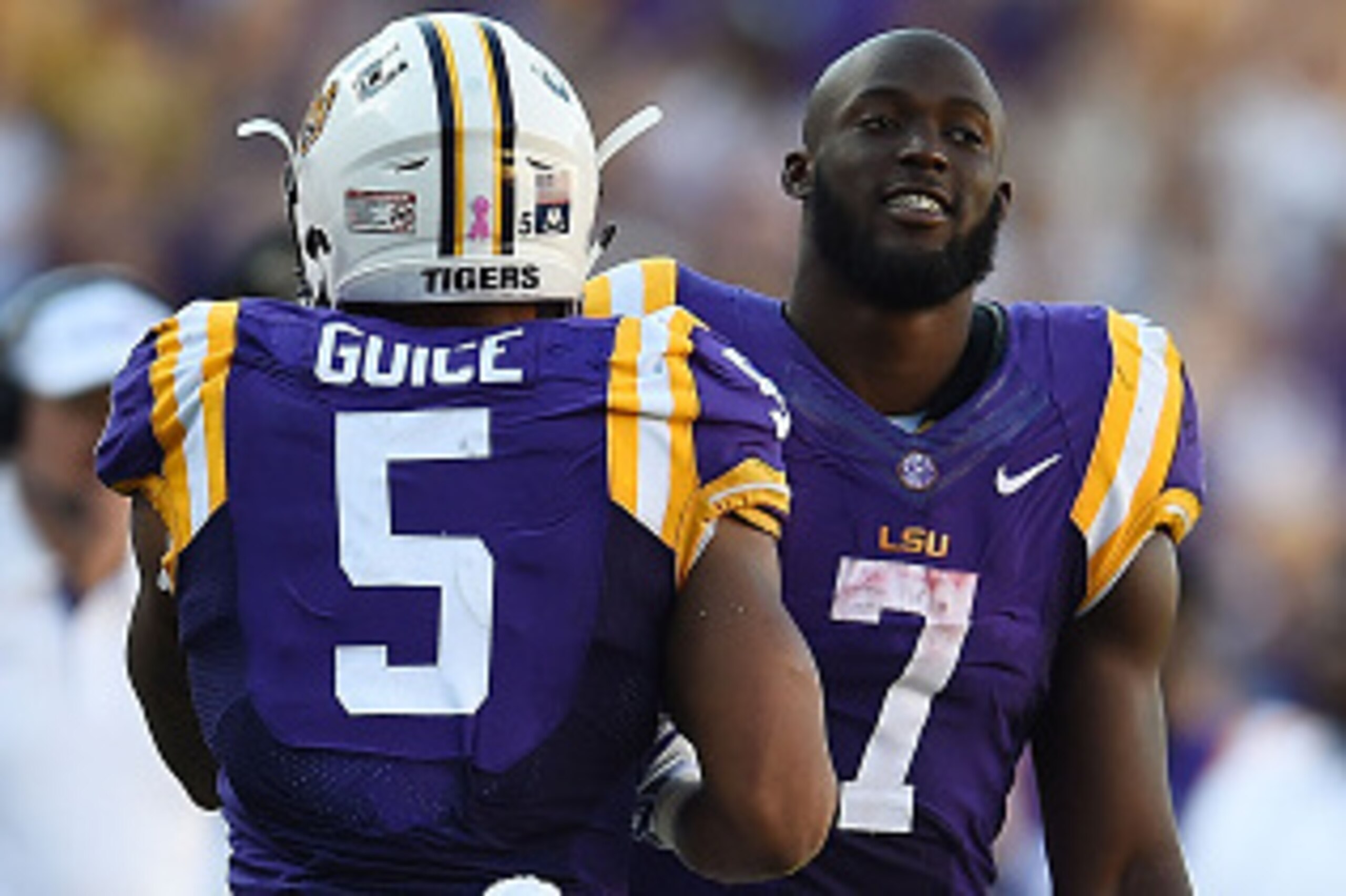 BATON ROUGE, LA - OCTOBER 10:  Derrius Guice #5 is congratulated by Leonard Fournette #7 of the LSU Tigers following a touchdown against the South Carolina Gamecocks at Tiger Stadium on October 10, 2015 in Baton Rouge, Louisiana.  LSU defeated South Carol