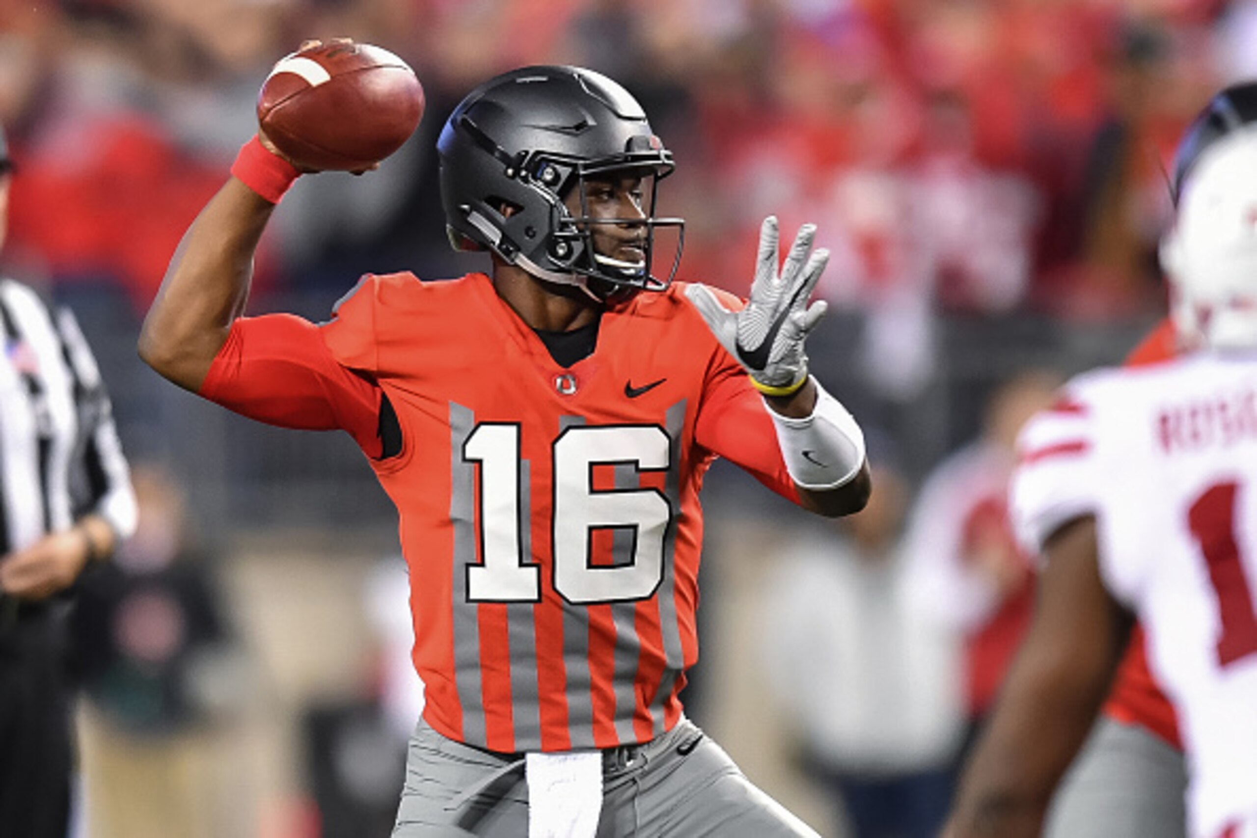 COLUMBUS, OH - NOVEMBER 5:  Quarterback J.T. Barrett #16 of the Ohio State Buckeyes controls the ball against the Nebraska Cornhuskers at Ohio Stadium on November 5, 2016 in Columbus, Ohio. Ohio State defeated Nebraska 62-3.  (Photo by Jamie Sabau/Getty I