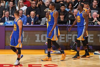 LOS ANGELES, CA - NOVEMBER 4:  Stephen Curry #30, Kevin Durant #35 and Draymond Green #23 of the Golden State Warriors walk on the court during the game against the Los Angeles Lakers on November 4, 2016 at STAPLES Center in Los Angeles, California. NOTE 