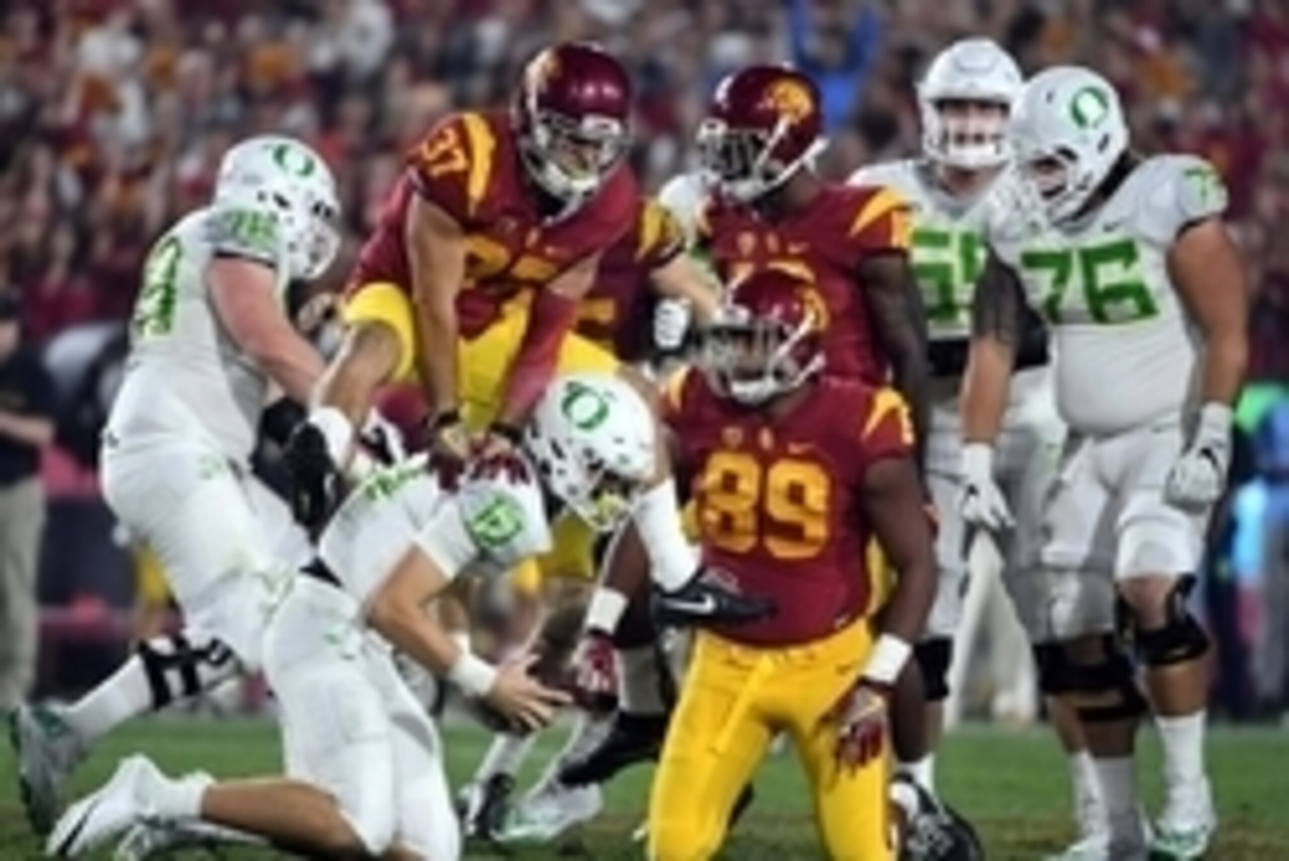 Nov 5, 2016; Los Angeles, CA, USA; Southern California Trojans defensive back Matt Lopes (37) leaps over Oregon Ducks quarterback Justin Herbert (10) during a NCAA football game at Los Angeles Memorial Coliseum. USC defeated Oregon 45-20. Mandatory Credit Nov 5, 2016; Los Angeles, CA, USA; Southern California Trojans defensive back Matt Lopes (37) leaps over Oregon Ducks quarterback Justin Herbert (10) during a NCAA football game at Los Angeles Memorial Coliseum. USC defeated Oregon 45-20. Mandatory Credit