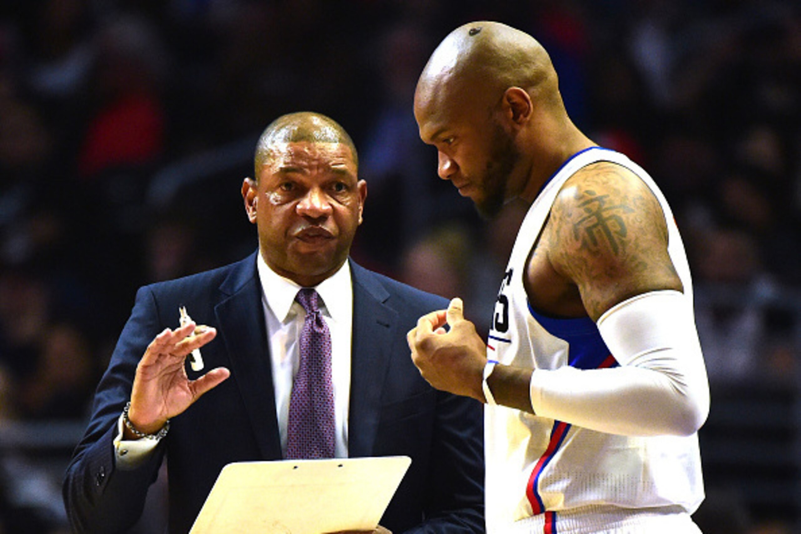 LOS ANGELES, CA - NOVEMBER 09:  Doc Rivers of the Los Angeles Clippers speaks to Marreese Speights #5 during the first half against the Portland Trail Blazers at Staples Center on November 9, 2016 in Los Angeles, California.  NOTE TO USER: User expressly