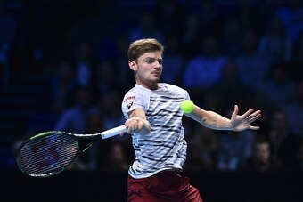 Belgium's David Goffin returns against Serbia's Novak Djokovic during their round robin stage men's singles match on day five of the ATP World Tour Finals tennis tournament in London on November 17, 2016. / AFP / Glyn KIRK        (Photo credit should read