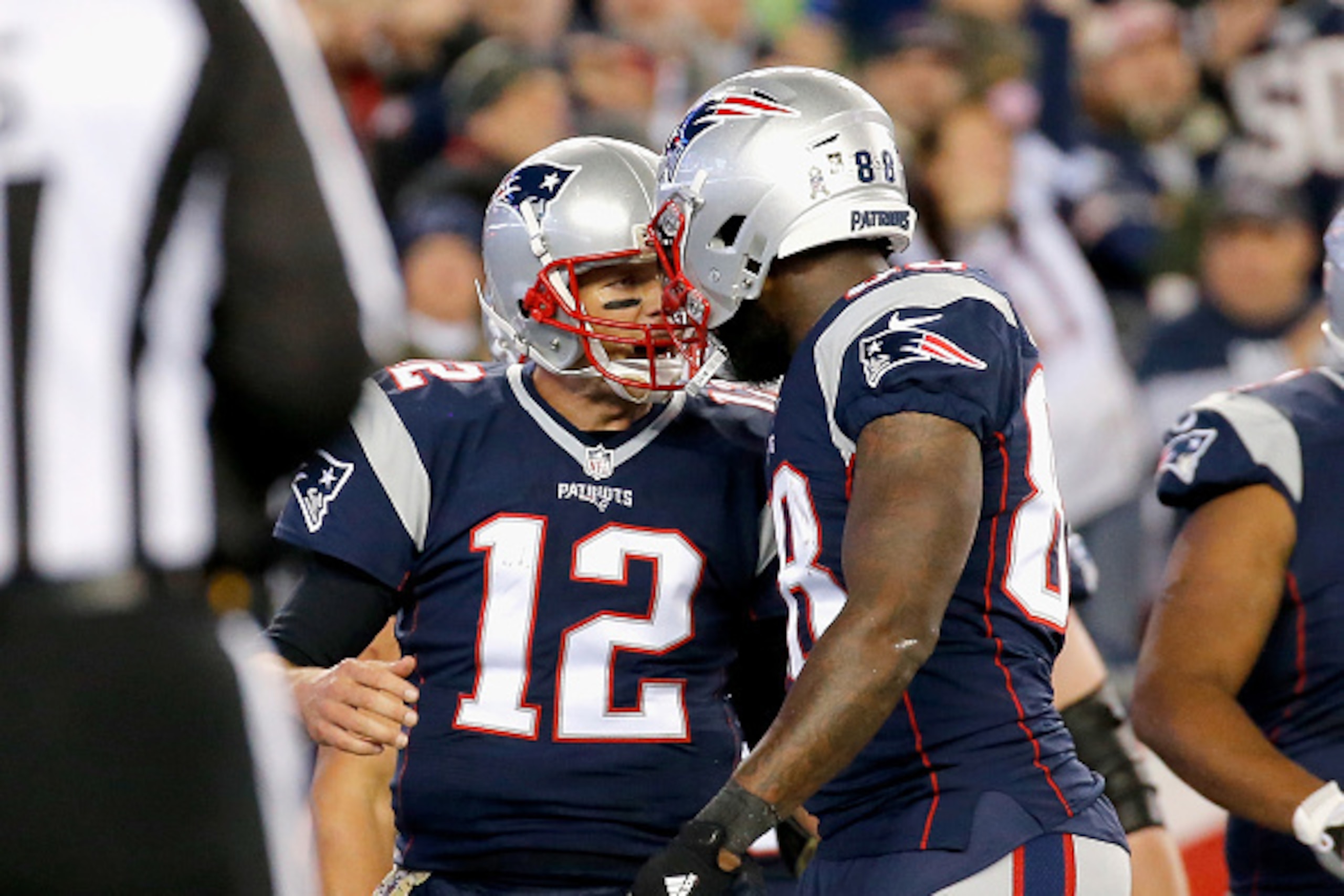 FOXBORO, MA - NOVEMBER 13:  Tom Brady #12 of the New England Patriots reacts with Martellus Bennett #88 during the second quarter of a game against the Seattle Seahawks at Gillette Stadium on November 13, 2016 in Foxboro, Massachusetts.  (Photo by Jim Rog