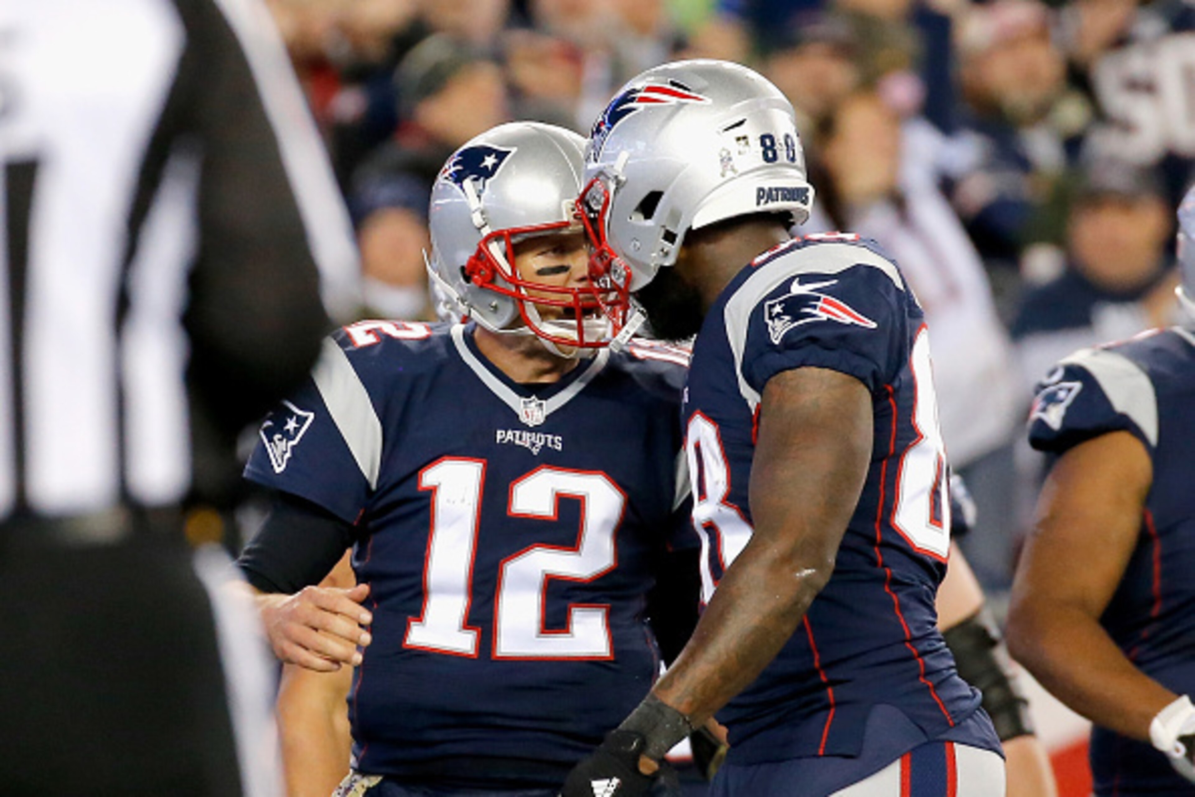 FOXBORO, MA - NOVEMBER 13:  Tom Brady #12 of the New England Patriots reacts with Martellus Bennett #88 during the second quarter of a game against the Seattle Seahawks at Gillette Stadium on November 13, 2016 in Foxboro, Massachusetts.  (Photo by Jim Rog