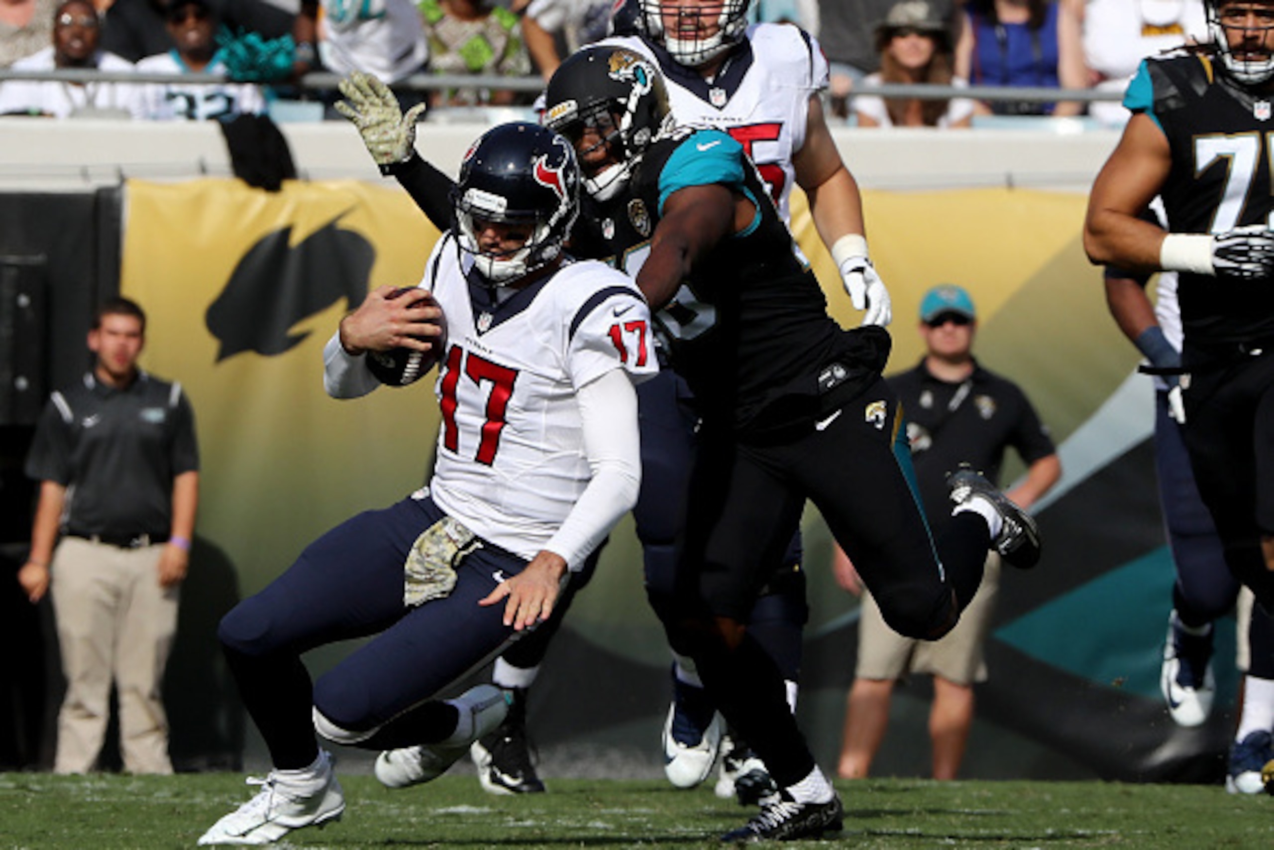 JACKSONVILLE, FL - NOVEMBER 13:   Dante Fowler #56 of the Jacksonville Jaguars brings down  Brock Osweiler #17 of the Houston Texans
during the game at EverBank Field on November 13, 2016 in Jacksonville, Florida.  (Photo by Sam Greenwood/Getty Images)
