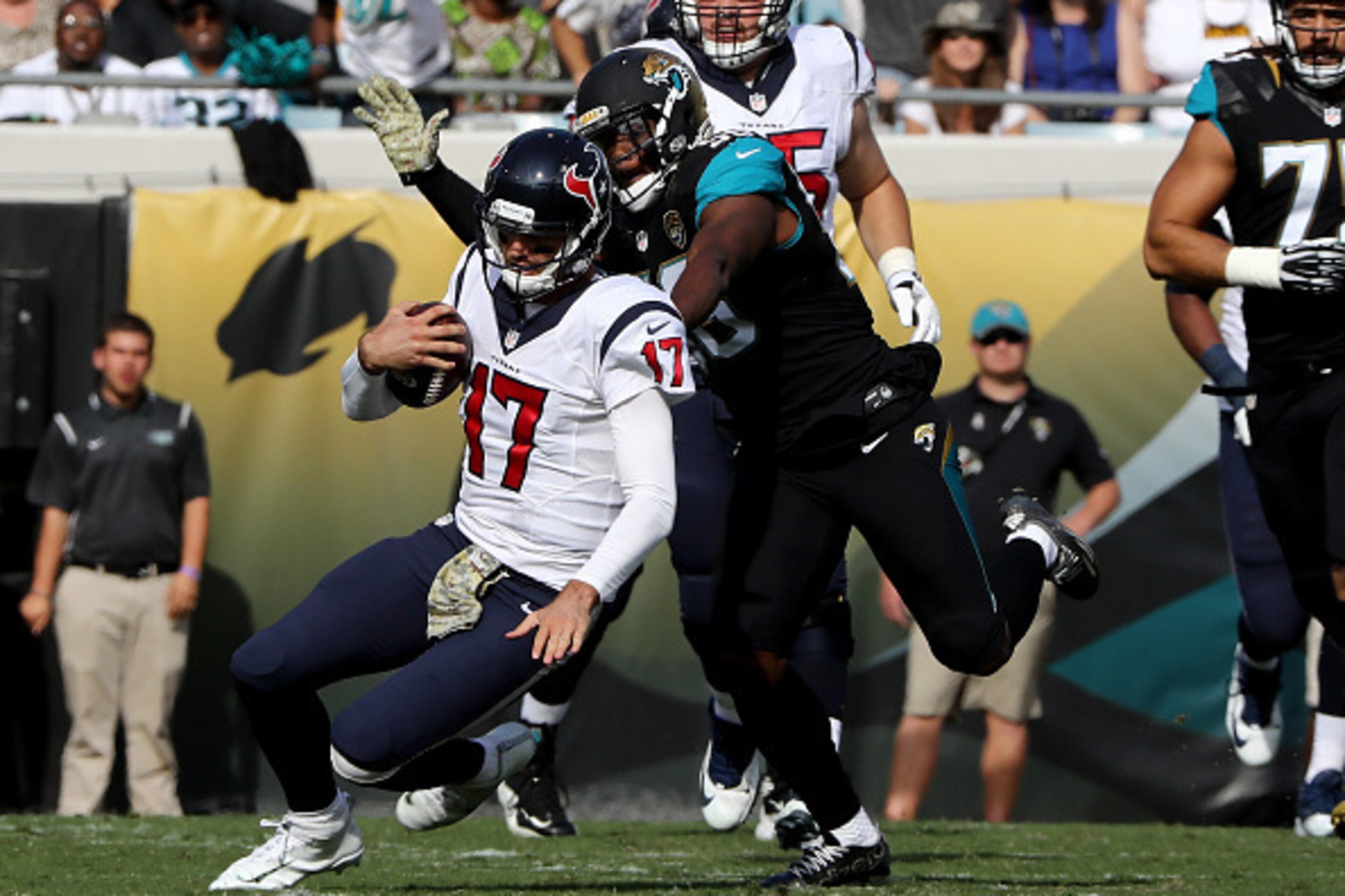 JACKSONVILLE, FL - NOVEMBER 13:   Dante Fowler #56 of the Jacksonville Jaguars brings down  Brock Osweiler #17 of the Houston Texans
during the game at EverBank Field on November 13, 2016 in Jacksonville, Florida.  (Photo by Sam Greenwood/Getty Images)
